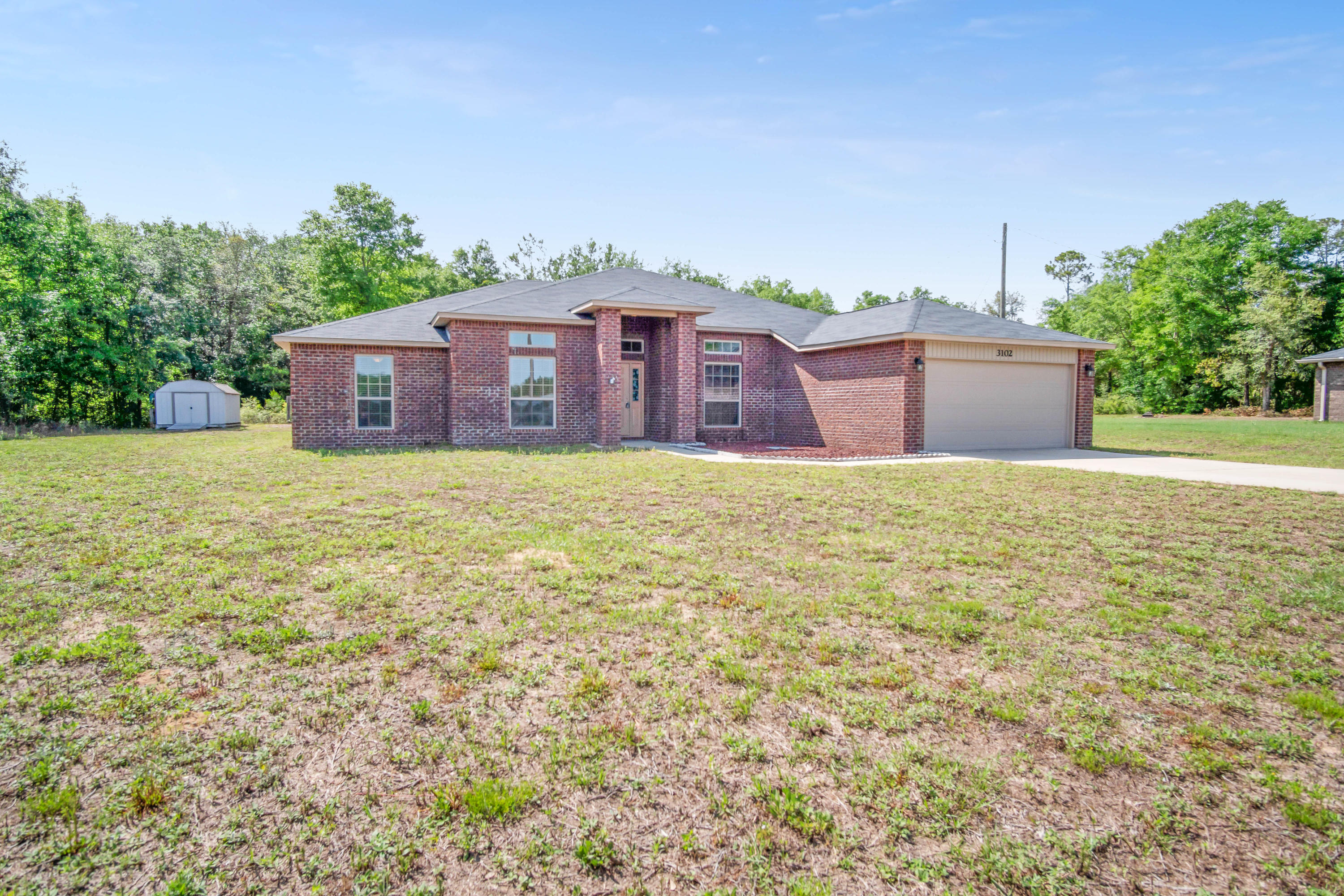 This property stands deep into a .59 acre lot at the end of a cul-de-sac in north Crestview. Its nearly 2700 square feet of open living space houses 4 large bedrooms and 3 bathrooms of which the master bedroom and ensuite itself takes up a whole wing of the home. This property features high ceilings, ample natural lighting, an expansive kitchen with an abundance of cabinet and countertop space and even has a sunroom which exits to a covered patio. Please consider this house for your next home.