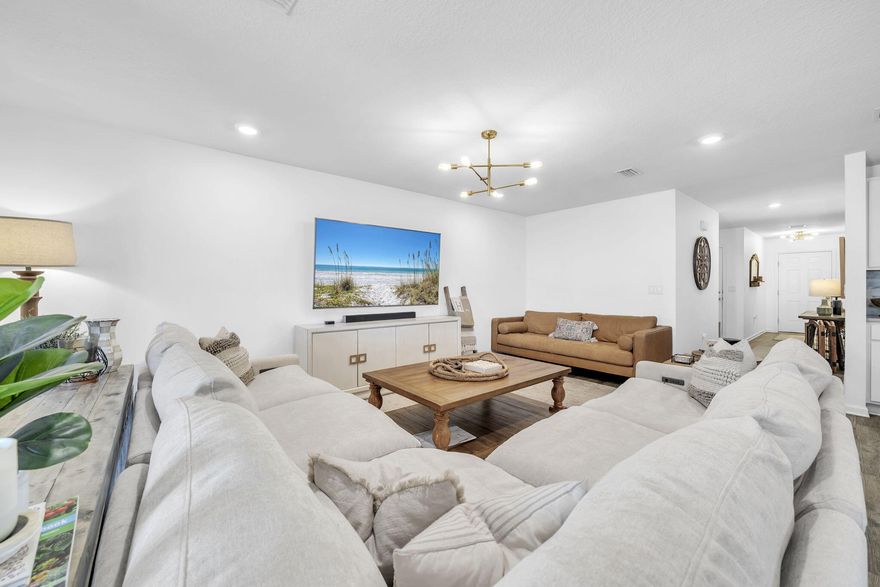 Welcome to this beautifully upgraded 4 bedroom, 2 bathroom residence located in the highly sought after master planned community of Hammock Bay in Freeport. Built in 2021 and offering 2,045 square feet of thoughtfully designed living space, this home blends modern comfort with a long list of high quality upgrades and meticulous care.The open concept floor plan creates a bright and inviting living space that flows seamlessly between the living room, dining area, and kitchen, making it ideal for both everyday living and entertaining. The kitchen has been enhanced with upgraded countertops, a stylish new backsplash, updated lighting, and a built in Monogram refrigerator that elevates both form and function. Smart WiFi light switches have been installed throughout the home, allowing convenient control of lighting from anywhere or through smart devices such as Alexa or Google. The home has been upgraded with new can lighting and updated light fixtures, creating a bright, clean, and modern feel throughout.

The spacious primary suite offers a private retreat with a generously sized bedroom, walk in his and hers closets, and an ensuite bathroom featuring quartzite countertops and a newly installed glass shower door. The secondary bathroom has also been upgraded with quartzite countertops, providing a cohesive and elevated finish throughout the home. Three additional bedrooms provide flexibility for guests, family, or a home office.

One of the most unique features of this property is the fully insulated, heated and cooled garage equipped with a dedicated mini split system, creating a versatile space ideal for a workshop, home gym, hobby area, or additional storage. Designed with enthusiasts in mind, the garage features upgraded LED garage lighting, creating a true car lover's dream environment. The garage also includes a wall mounted pressure washing system, making washing your vehicles extremely convenient. 

Outdoor living is just as impressive, featuring an extended paver patio designed for relaxing or entertaining, recessed patio lighting, a fully fenced backyard, and a 4 person hot tub. The property also includes a Rachio smart irrigation system that makes lawn maintenance efficient and convenient. A golf simulator net is currently installed and can remain with the home if desired (net only, turf mat not included).

This home has been meticulously maintained with premier Chem Dry professional carpet cleaning performed every six months, a professional home cleaning program every three weeks, and landscaping refreshed twice annually, reflecting the pride of ownership and level of care given to the property.

Located within Hammock Bay, one of Freeport's most desirable communities, residents enjoy access to resort style amenities including multiple pools, a fitness center, tennis and pickleball courts, walking and biking trails, a dog park, playgrounds, and a beautifully designed clubhouse. The community also features its own general store, brewery, and a calendar of neighborhood events that create a vibrant and connected lifestyle.

Conveniently located near Highway 331, this home provides quick access to Choctawhatchee Bay, the world class beaches of 30A, and the dining, shopping, and outdoor recreation that make the Emerald Coast one of the most sought after places to live.

Select furnishings may convey.

Seller is a licensed real estate agent in the state of Florida and is self representing in this transaction.

Information contained herein is deemed reliable but not guaranteed. Buyer is responsible for verifying all dimensions, measurements, and any information important to their purchase decision.