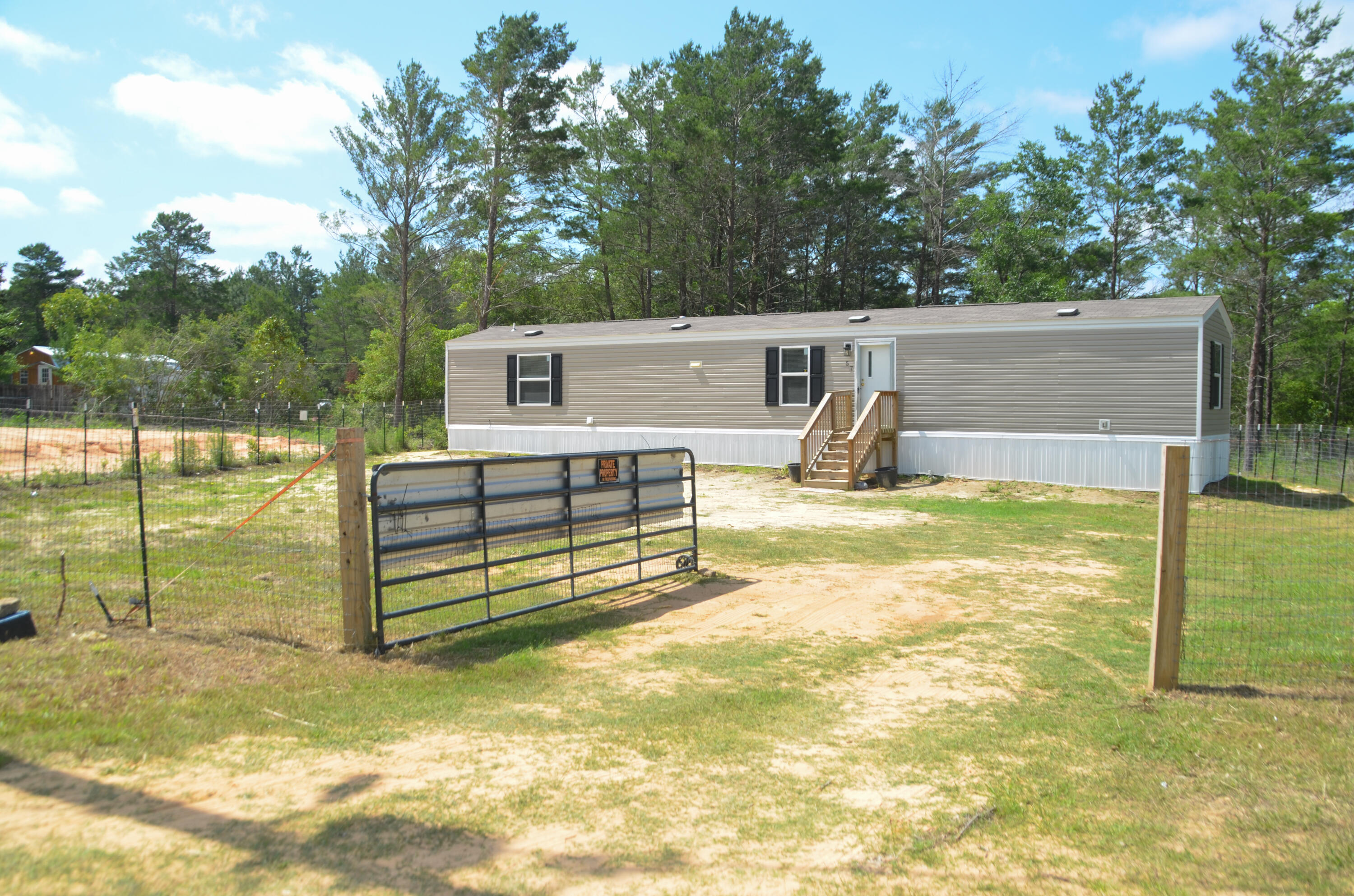 Escape the the hustle and bustle and make this your new home with a fully fenced yard and gate. Bring the animals!! 3 bedrooms, 2 baths and a great wooden deck for relaxing and grilling in the back yard. No HOA.