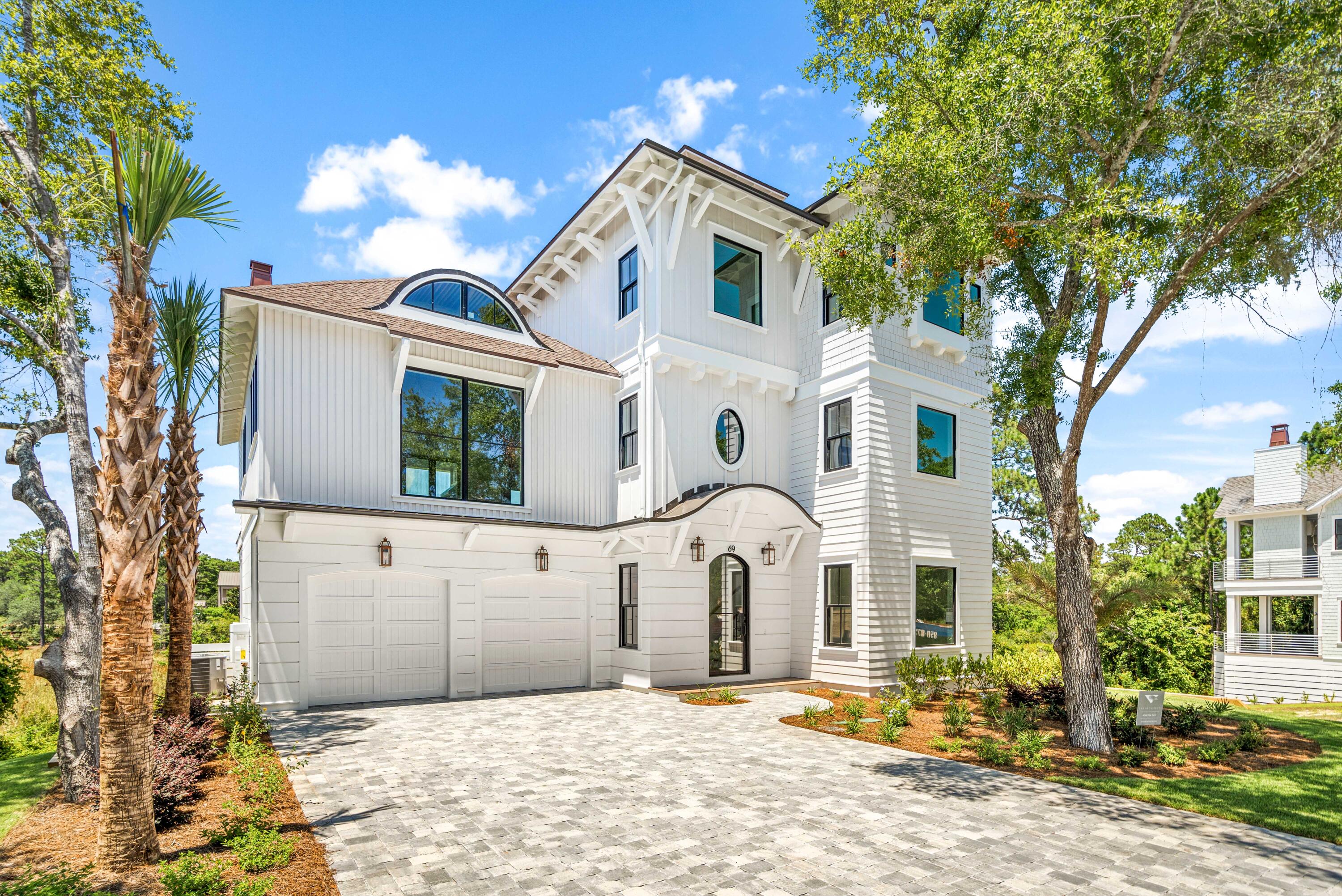 Sweeping views across Camp Creek Lake accentuate the stately lines of this majestic new construction residence nestled along a private lane mere steps from the beach, the 30A bike path, restaurants and shops. There is also an option to add a pool. Boasting over 4,000 square and including 4 bedrooms plus study, and 4.5 bathrooms, the interiors of this residence stun from the moment of entry with an arched front door, intricate millwork from crown moldings to wall details, paneled and beamed ceilings, gold accents, and so much more. The home design maximizes the peaceful lake views with a stunning living area featuring a vaulted natural wood ceiling, gas fireplace, built-in cabinetry, and a wall of bifold doors that open to a covered porch with summer kitchen and outdoor fireplace