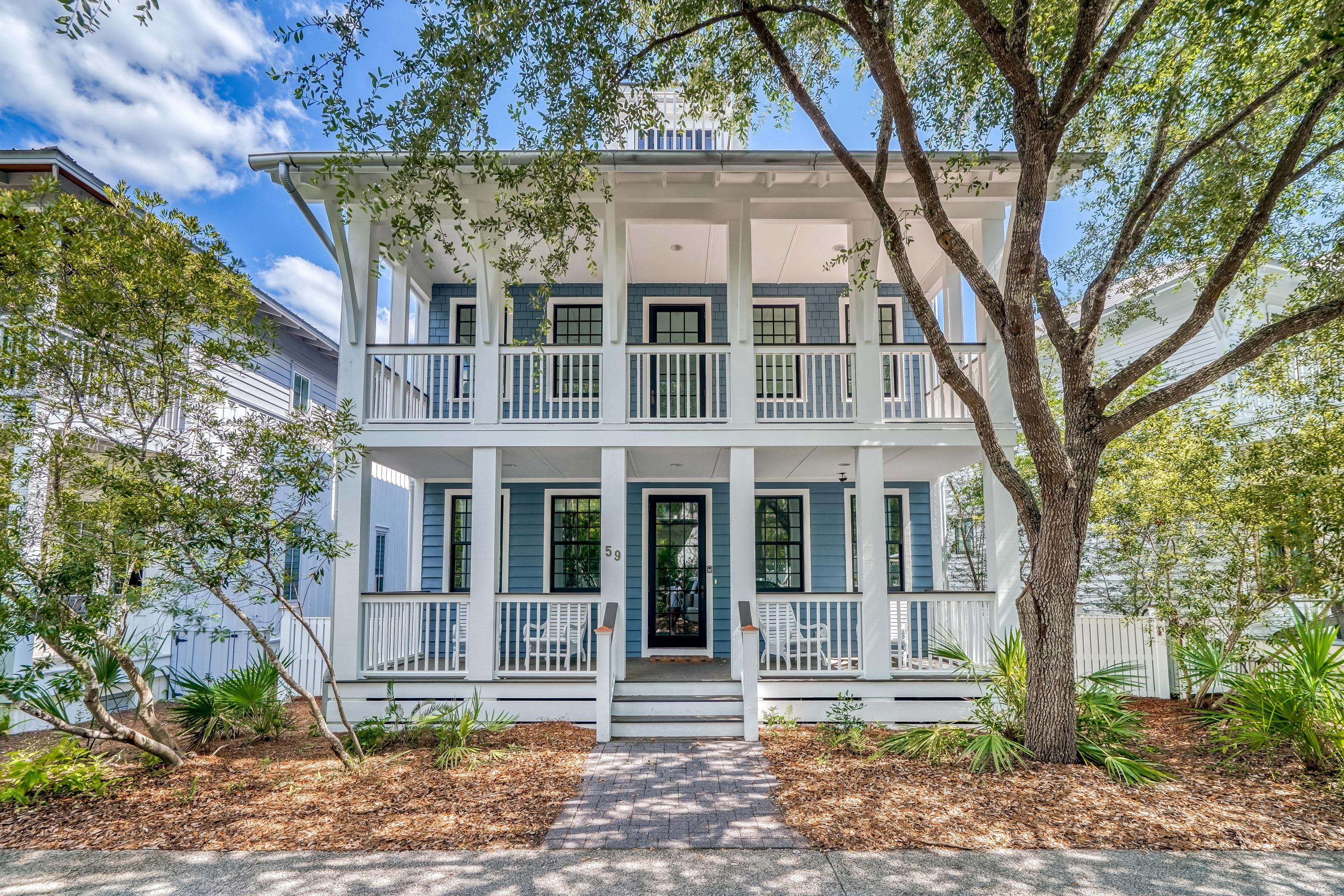 Tucked away on West Water Street in the heart of Rosemary Beach, this three-story home with a detached carriage house placed over a two-car garage has never been rented and overlooks the Cabana Pool and Park. Offering four bedrooms with four and a half baths, this 2,907 square foot home greets you with a spacious covered front porch and rockers arranged for conversation. You will find beautiful wood floors throughout the home and an additional living room on the main level, as well as, a coveted main floor master suite and an expansive guest room with an attached bath that is also accessible from the living area. The master suite boasts a spacious bathroom with dual vanities and a glass shower. The home's great room is situated on the second level. This home has recently been updated.