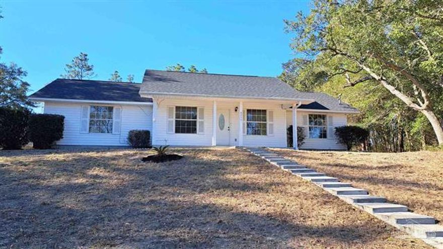 'REO' Great deal on this 3 bedroom, 2 bath home that has super curb appeal! Set back from the road on a large half acre lot. This home offers an open concept floorplan with high ceilings in the living area, breakfast bar and a good size kitchen & dining area that opens to the screened Florida room. New roof