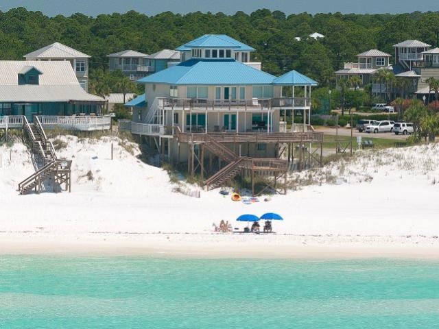 With a name like Out of Sight, this house is sure to amaze. Beautiful Gulf front home with over 68 feet of beach front has 3,000 sq.ft. of outdoor deck space so you can enjoy the beach life to the fullest. This uniquely designed four-story home features 6 bedrooms and sleeps up to 20. Located on the 2nd floor is the newly remodeled kitchen with granite counters, stainless appliances, gas stove and two dining tables and bar seating to accommodate all. Also on the 2nd floor the open living area opens to a large porch and deck for enjoying great gulf views. This house is currently on a vacation rental program and generates over $100,000 in gross rentals yearly. Property sold ''AS-IS''