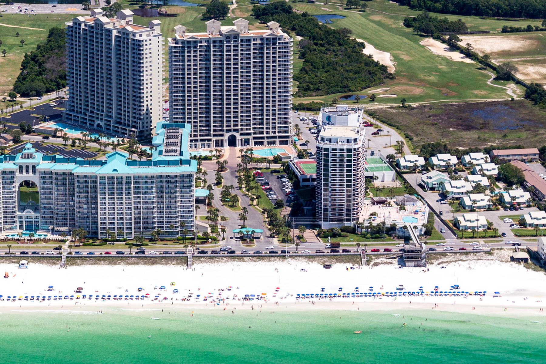 Nestled along the stunning Gulf Coast in Destin, Florida, the Surfside Resort presents this luxurious 1313 Sq Ft 2 Bedroom - 2 Bath Condo with an expansive Living Area surrounded by windows spanning the entire Balcony offers comfort, elegance, and unparalleled ocean views from inside or outside. This condo is perfect for families, couples, or anyone looking to experience a tranquil beach getaway. The Resort is located near a variety of dining, shopping, and entertainment options. Enjoy local restaurants, shops, and water activities, all just minutes away. The Surfside Resort also features its own 2 Restaurants, Pool, Hot Tub, Bar, Spa, plus Tennis, Basketball, and Shuffle Ball Courts, a Grilling Area, and its very own Sky Bridge over to the beach offering SAFETY for your family!!!