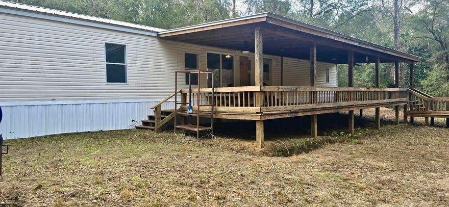 5 acres in the country with a 2000 model single wide home with large covered front porch, tool shed and large double bay,  detached garage well and septic tank. .  Needs a little TLC.  Cash contracts only, property being sold in  'as is' condition.