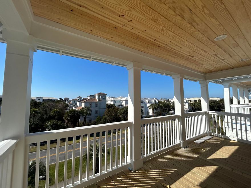 Tucked within the sought-after Seacrest Beach community along scenic 30A, this beautifully crafted new construction home delivers an effortless blend of upscale design and easygoing coastal charm--and it's offered fully furnished. With five spacious bedrooms and four and a half baths, the home showcases wide-plank engineered wood flooring throughout, creating a warm, cohesive feel across every level. Thoughtfully designed for both privacy and togetherness, the floor plan features two primary suites--one on the first floor and another on the top level--making it ideal for hosting guests or accommodating multi-generational living. Three separate living areas provide plenty of room to spread out, whether gathering as a group or enjoying quiet downtime. The first-floor living space anchors the home with a striking 72-inch electric fireplace that adds a contemporary touch and inviting ambiance. Upstairs, the second level offers an additional lounge area that flows seamlessly onto a covered porch, perfect for catching coastal breezes or entertaining with ease. The kitchen is both functional and stylish, featuring shaker-style cabinetry, quartz surfaces, a designer tile backsplash, and high-end appliances suited for everyday living or special occasions. Nearby, a well-appointed wet bar--complete with open shelving, a wine fridge, and an ice maker--enhances the home's entertaining appeal.

The third floor presents yet another living space along with an expansive balcony featuring a summer kitchen and beautiful Gulf views, creating an ideal setting for sunset gatherings or relaxed evenings overlooking Scenic 30A.

Modern conveniences include a Rinnai tankless water heater for endless hot water, as well as an in-home washer and dryer for added ease.

Residents of Seacrest Beach enjoy access to a convenient community shuttle, making trips to the Gulf's sugar-white sands simple and stress-free. Beyond the beach, you're just moments from the charming towns of Rosemary Beach and Alys Beach, where boutique shopping, dining, and local favorites await. Outdoor recreation is abundant, from nearby golf at Camp Creek to kayaking, hiking, and fishing at Camp Helen State Park along the peaceful shores of Lake Powell.