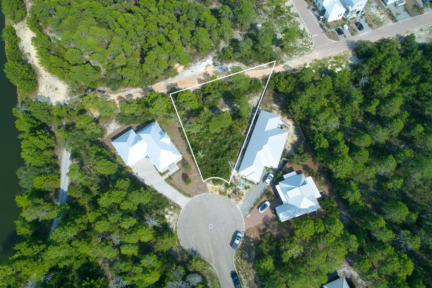 Oversized .33 of an acre lot on the peaceful end of 30A. Quiet street with full time residents and some second homes. TAP FEES have been pre-paid. One water and one sewage line total of $8603.00 have been pre-paid.  Walking distance to Butler Elementary and close to shopping and dining. High and dry, Flood zone X to build your dream home. Walking distance or a short bike ride to Stallworth Lake Beach Access which takes you right to the three miles of undeveloped beach at Topsail State Preserve. A new regional beach access with parking and restrooms is also walking distance away.  NO HOA *Buyer is responsible for all due diligence and verifying lot dimensions*