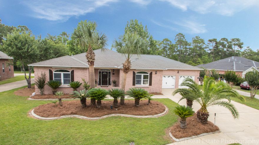 Introducing this 3 bedroom, 2 bathroom home in the Dana Pointe community in Niceville on nearly half an acre. The star of this home is the updated kitchen and it is definitely one to be seen. Complete with Kenmore ELITE Stainless Steel appliances and an exotic GRANITE, it is a joy to cook in. The kitchen has a spacious island open to the living room featuring a wood burning stove. Off the living room is the sunroom with wood look tile floors. This opens to an oversized deck with pergola and fenced in back yard. The home features an outdoor shower, ready for your future pool. Out back is a storage shed and double gate to back your boat through for privacy. There is an oversized garage with 2 single garage doors and a bonus fitness and laundry area not included in overall SF.