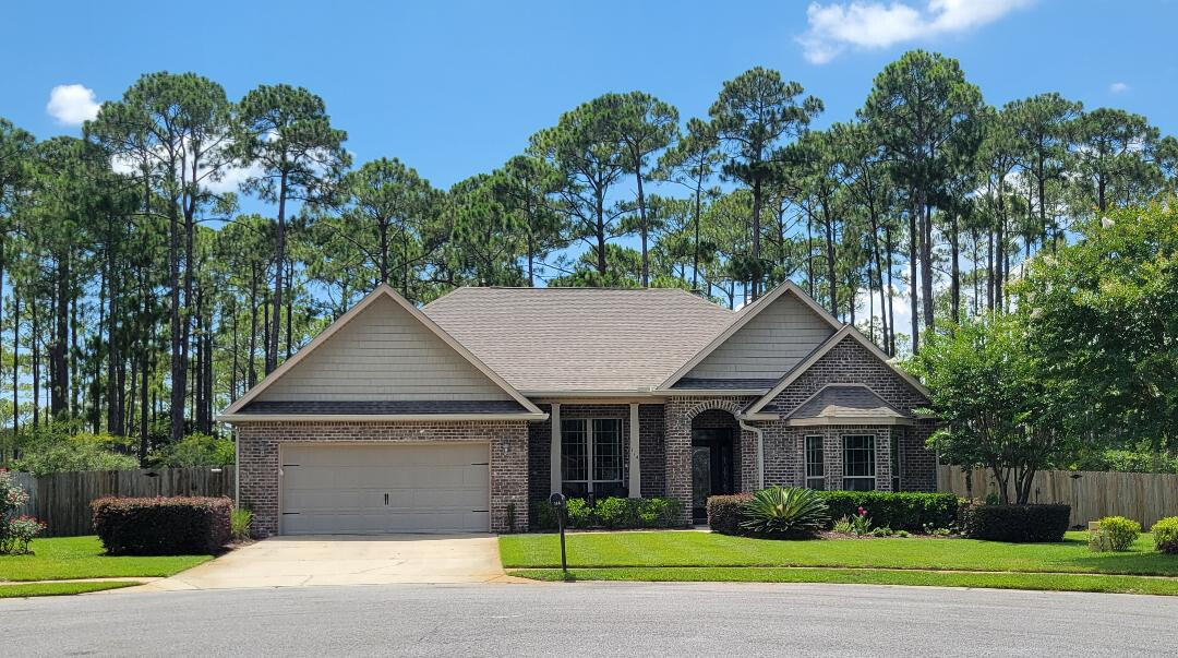 Away from it all, in the middle of it all. This all brick, well maintained home is in a great location. Feels like you are in the country but less than 5 miles to the beach, Grand Blvd and Gulf Place. Located in a cul de sac within a quiet, gated community with great neighbors. This home backs up to a Nature Preserve so you can enjoy privacy on your backyard patio and relax in your screened in porch while watching the deer show up for their daily graze in the woods. One of the largest yards in the neighborhood, fenced in and comes with a built in irrigation system. Great home for entertaining with lots of outdoor space to spread out. Come see why this home is a special place!