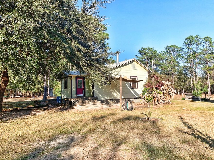 2 bedroom 1 bath cottage style home on 4 acres! There is also a guest house with a small kitchenette that is 256 square feet. Large pole barn built in 2015. Approximately 2 acres are fenced. There are several outbuilding for chickens, goats or any farm animal that you desire. Inside the main house, there are tile floors through-out the kitchen and living area. Wood burning corner fireplace in the living area. 2 bedrooms with plenty of closet space and built-in storage. Full bath located between both bedrooms. Seller will offer $2000 credit to buyer for paint/dry wall repair with full price offer. All measurements must be verified by buyer.