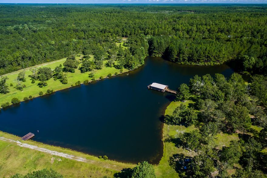 This 40 acre parcel is considered by many to be one of the finest freshwater fish camps in Northwest Florida. The custom built 8-9 acre freshwater lake is stocked with Trophy Florida Black Bass, Catfish & Georgia Copperhead Bream. The 1224 S.F. executive cabin is built over the lake giving you a panoramic view of this outdoor recreational paradise (see pics! awesome). The land is a mixture of pasture, woods and rolling hills. Perfect for horses, raising cattle and hunting. High deer and turkey populations. Shown by appointment. Listing agent must accompany. 24 hour notice please. Cash offers only.