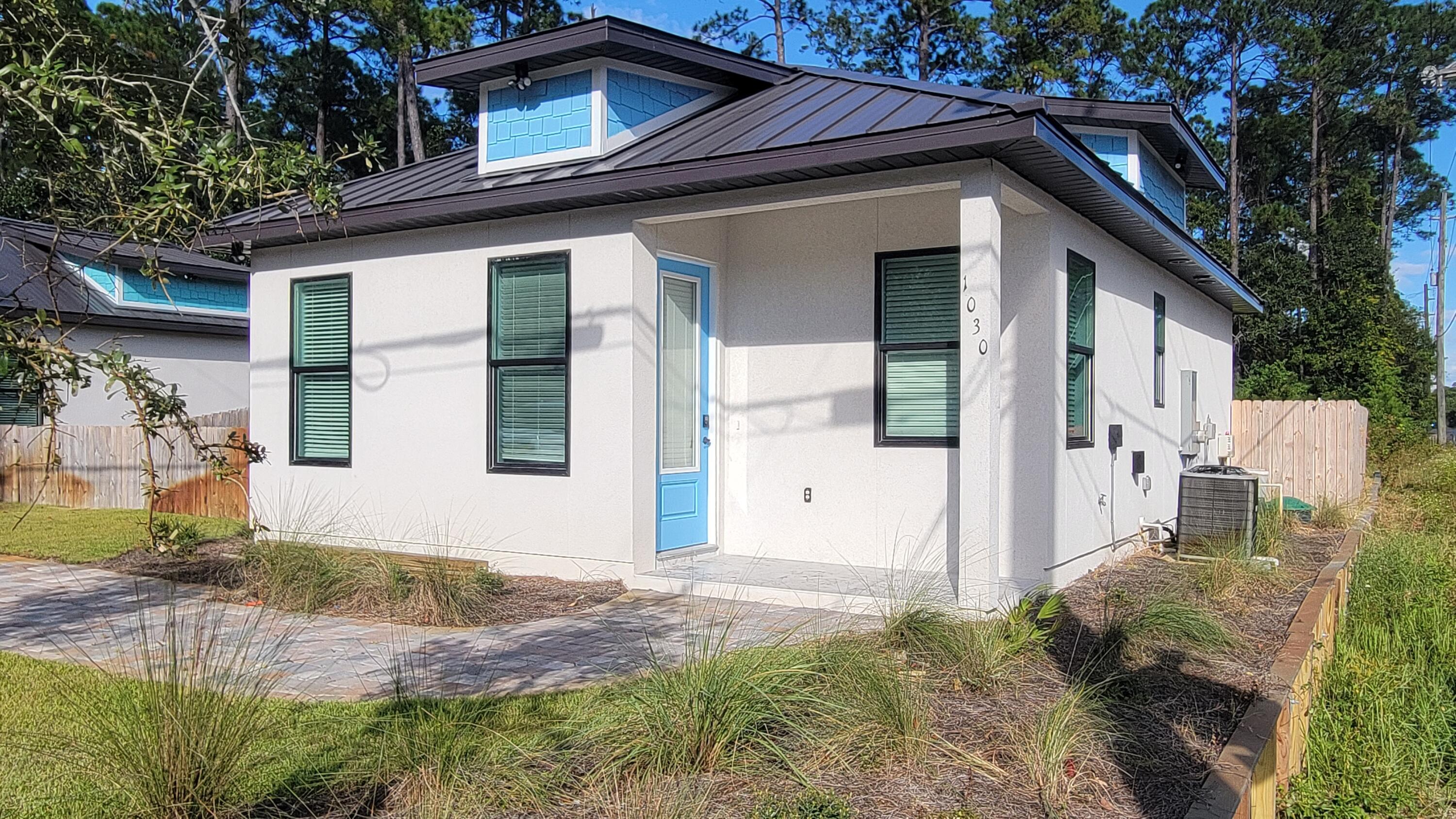 This UPSCALE BRAND NEW 2BR/1.5BA home, is located in Santa Rosa Beach. LVP flooring throughout. Master bedroom has walk in closet with built in shelves and drawers, to help you get organized. Walk in ceiling to floor tiled shower. Stainless steel appliances, granite countertops, large open kitchen, plenty of cabinets. Separate laundry room with washer dryer connections. Covered front and back patio. Ceiling fans in the bedrooms. Fenced in back yard. Lawn care included No smoking. No pets. SD