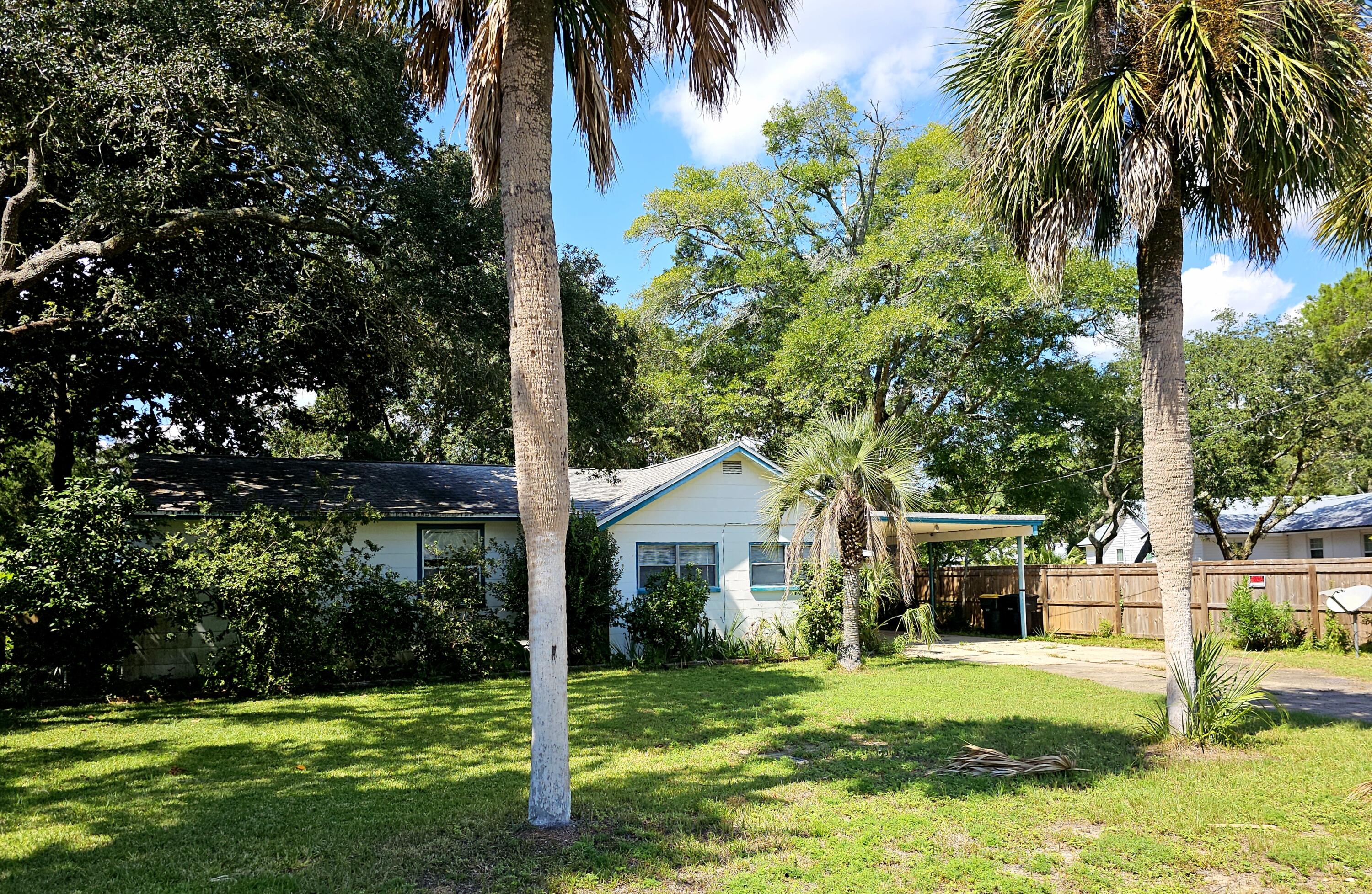 This is the perfect opportunity to 'own in' the popular bayside Garniers Beach neighborhood, and a perfect opportunity to make this home your own. THE HOME NEEDS SOME WORK and is being sold AS IS.   This cute Florida cottage is unique, with an open concept living/dining/kitchen area, 3 bedrooms, 2 full baths, and indoor laundry.  There is a screened-in back porch, a single carport with outdoor storage and there is a great little storage shed with electricity on the backside of the large lot.    The fenced-in backyard is an open invitation to enjoy mother nature while providing a sense of privacy.  Garniers Beach Park and all that it offers is within 2 blocks of this home.  This property is located within the Fort Walton Beach City limits and is convenient to all area Bases, beaches, golf, downtown, shopping, and Cinco Bayou boat ramp!  Whether you're entertaining guests or simply relaxing with family and friends, this inviting space offers the ideal setting for year-round enjoyment. Owners have never occupied the residence and are only aware of conditions readily observable for disclosure purposes, ( i.g. a gutted bathroom, the back porch area needs to be rescreened, not sure of any systems, etc).   Don't miss the chance to make this delightful home yours!  CASH ONLY.   Buyer(s) is responsible for verifying all data and information including lot size and room measurements as it is deemed to be reliable but not guaranteed.