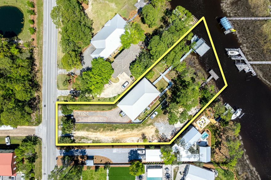 Welcome to your dream coastal retreat, nestled on the serene waters of Mack Bayou in beautiful Santa Rosa Beach, Florida. This exquisite double-lot waterfront estate spans nearly 1 acre of lush, private grounds with no HOA and boasts an impressive 136 feet of water frontage, delivering the perfect blend of luxury, space, location, and lifestyle. Tailored for boating enthusiasts, wildlife lovers, and anyone who craves the very best in coastal living.Ideally situated just 2 minutes from Sacred Heart Hospital, 3 minutes from Grand Boulevard, and 5 minutes to the sugar-white sands of the Emerald Coast and Scenic Highway 30A, this location offers unparalleled access to everything you need. Grand Boulevard is a vibrant hub of fine dining, boutique shopping, entertainment, and grocery option  s  all just around the corner. Whether it's a spontaneous beach day, upscale dinner, or a quick grocery run, convenience is never compromised.

This property is an absolute dream for boaters, with two private docks, including one with a 10,000 lb boat lift ideal for accommodating multiple vessels or enjoying the water from different vantage points. Launch directly into Mack Bayou and enjoy a quick ride to the open bay, where over 30 waterfront restaurants await your arrival by boat. And when it's time to unwind, Crab Island, the Emerald Coast's most iconic sandbar destination, is just a 30-minute boat ride away.

Nature lovers and anglers alike will appreciate the daily visits from dolphins, majestic osprey, and bald eagles soaring overhead. The surrounding waters teem with marine life, offering exceptional fishing for redfish, spotted trout, mangrove snapper, snook, sheepshead, black drum, and more. Whether casting a line from your dock or cruising to secret inshore spots, this is a sportsman's paradise.

Crafted for both luxury and functionality, this home features:
 Elevator for effortless access across multiple levels.
Oversized garage with ample space for vehicles, golf carts, and water toys.
Open-concept living areas with stunning water views
Expansive outdoor living spaces perfect for entertaining or quiet moments by the bayou.
High-end finishes and architectural details throughout.
From coffee at sunrise to cocktails at sunset, this home invites you to embrace every moment of waterfront living in comfort and style.

Set on nearly an acre of land across two lots, you'll enjoy exceptional privacy, generous outdoor space, and flexibility for future expansion. Whether you dream of adding a pool, guest house, lush gardens, or simply enjoying wide-open green space, this estate offers the rare luxury of room to grow and breathe.

This rare waterfront property is more than just a home it's a lifestyle. From world-class boating and fishing to beach days, fine dining, and shopping just minutes away, every day feels like a vacation. Whether you're seeking a primary residence, a coastal getaway, or a valuable investment, this Mack Bayou estate is a one-of-a-kind opportunity in one of Santa Rosa Beach's most sought-after locations.

Schedule your private showing today and come experience the unmatched beauty, space, and lifestyle this waterfront estate has to offer.