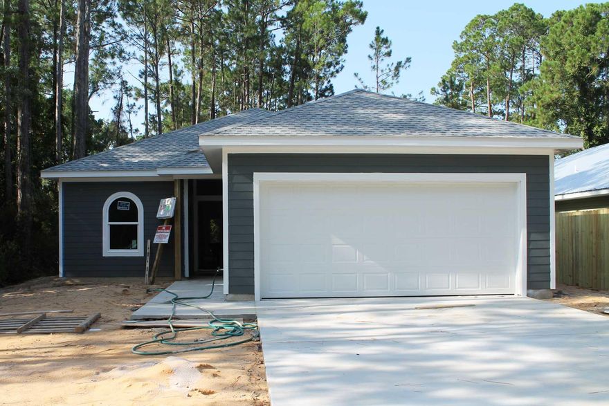 New home located just east of Bluewater Bay. Thoughtfully designed 3 bed 2 bath home with flex room that could be used for a dining room or home office. The home has over 1,600 sq ft of living space with premium vinyl flooring in the main living area and carpet in the bedrooms. The kitchen includes two toned cabinets, quartz countertops, stainless appliances and pantry. Master bath has a double vanity, a spacious custom tiled shower and a walk-in closet. Save on insurance with hurricane rated windows. You will enjoy relaxing on the covered patio overlooking the private backyard. Completion expected by the end of August.