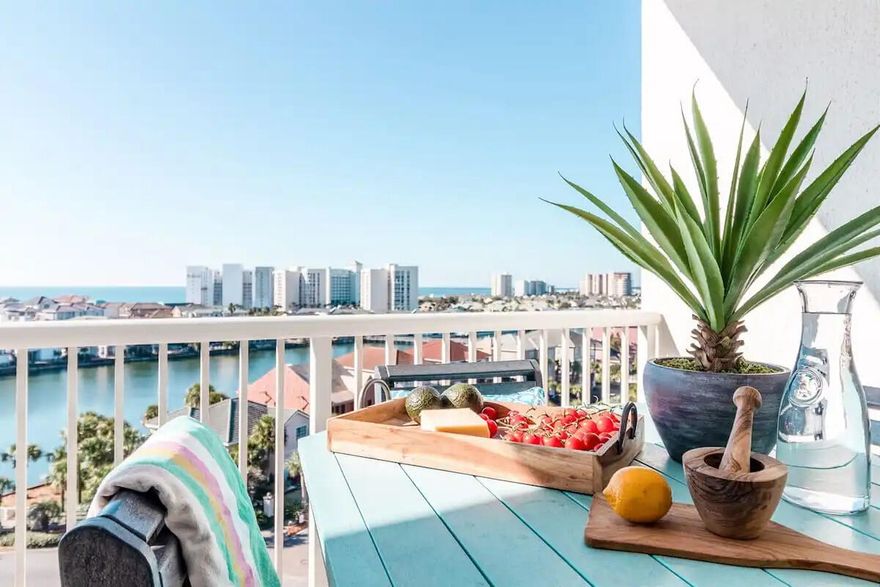 Welcome to The Terrace at Pelican Beach - the perfect place for those seeking the ultimate convenience, comfort, and resort-style living.  This stunning 2 bedroom, 2 bathroom condo boasts incredible views of the Gulf, Harbor, Lake and City, making it the perfect retreat for anyone looking to enjoy the best that Destin has to offer. The beautifully updated and renovated condo comes fully furnished and rental ready, making it the ideal choice for those looking to invest in a turnkey vacation property.  The spacious living area is beautifully  decorated and has floor to ceiling windows and doors that allow you to take in the stunning views from the comfort of your own home.