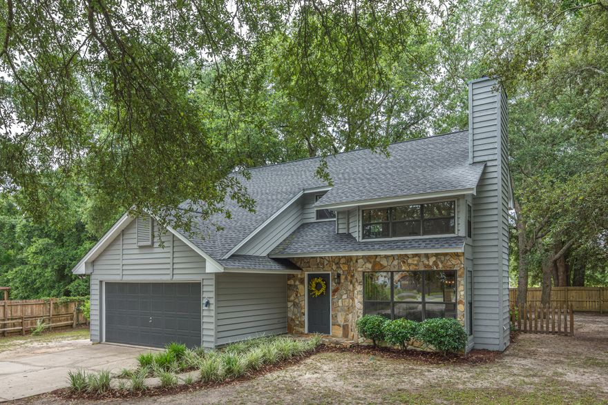 Welcome home to this charming house south of I-10 and on .33 of an acre. The home has laminate flooring on first floor with living area, formal dining, kitchen,  additional sitting room and half bath. Upstairs you will find a spacious master suite with bath. 2nd and 3rd bedrooms are good sizes and a full bath. Large backyard with paver patio. Mature trees on lot. 2 car garage. Quick commute to bases. Low county taxes. Roof Dec 2018. HVAC both units April 2018. W.ater heater April 2019.