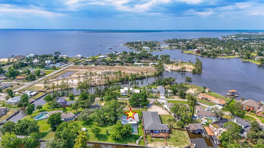 Waterfront Paradise - A Hidden Gem w/Gulf Access If you love boating, fishing, and outdoor living, this is the home you've been waiting for! This charming property has been lovingly owned and maintained by the same family since it was built, and it truly shows in every detail. Situated on a double-sized .84-acre lot with 204 feet of canal frontage, this home offers direct Gulf access and your own private boat dock--perfect for launching a day of fishing or cruising to Shell Island. You can even enjoy a romantic evening out by boat, with several waterfront dining spots just minutes away. The expansive yard is a true showstopper, shaded by majestic 100-year-old trees that have been carefully maintained by a professional arborist. Vibrant hydrangeas and lush landscaping create a peaceful,  garden-like atmosphere. With two separate irrigation systemsone for each parcelkeeping the grounds beautiful is a breeze. Kids and pets will love the room to run and play, and the boardwalk along the water offers a perfect spot for casual fishing or simply enjoying the view. When it's time to cool off, the sparkling screened-in pool provides a refreshing escape. Inside, the home is comfortable, open, and welcoming. The family room features a decorative fireplace and overlooks the pool and backyard. The kitchen, dining, and living areas flow effortlessly, making it easy to entertain or unwind. There's also a versatile bonus room that can be used as an office, sitting area, or even a 4th bedroom. Additional features include a whole-house propane generator for added peace of mind and a jointly owned parcel across the street, offering extra guest parking and natural privacy. Located in the sought-after Pretty Bayou community, you're just minutes from the beach, local restaurants, and shoppingbut you'll feel a world away in this private, serene setting. Don't miss your chance to own this rare and treasured waterfront retreatwhere every day feels like a vacation. This rare find is more than a homeit's a lifestyle.