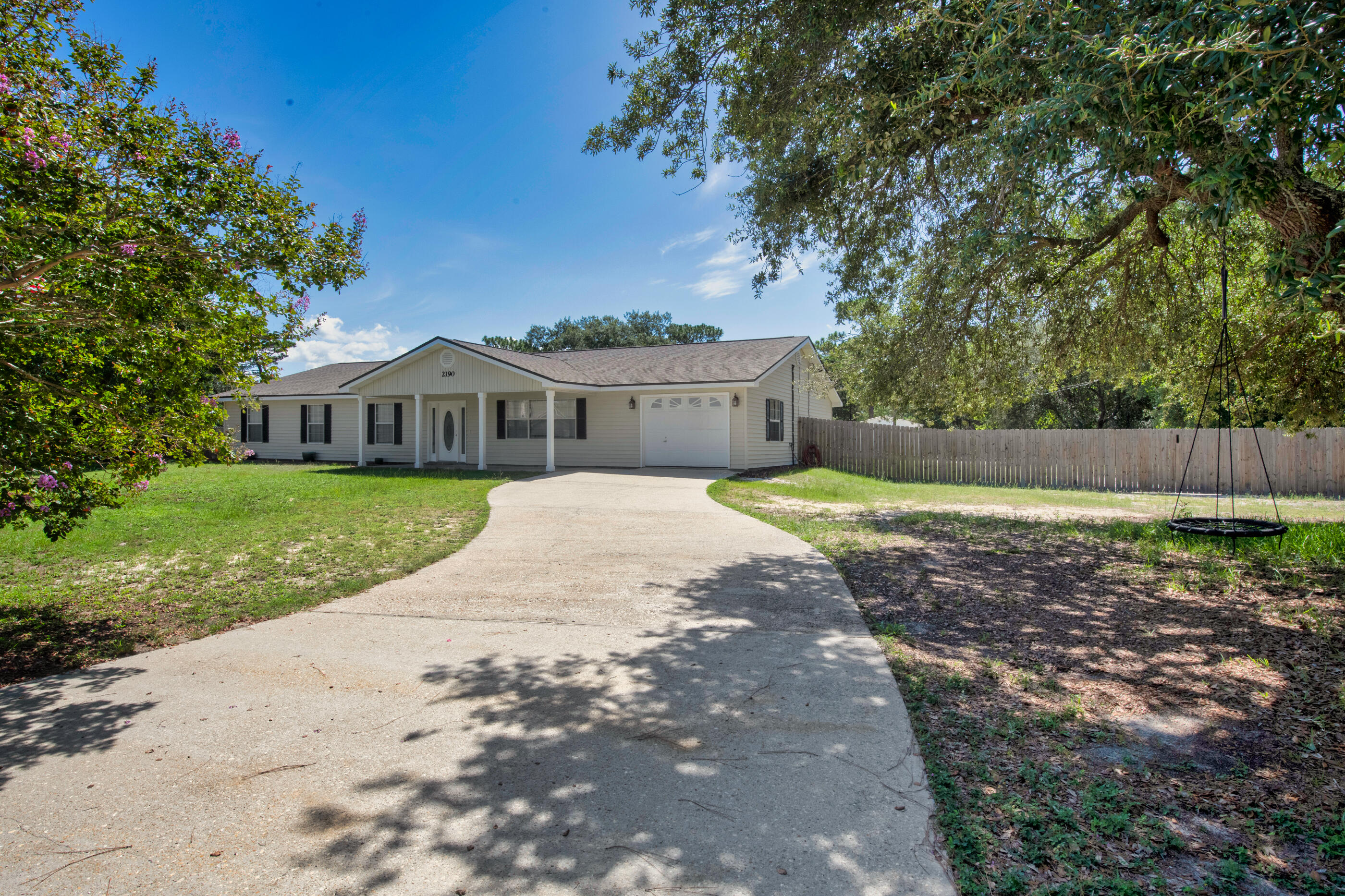 Welcome to 2190 River Birch Rd in Gulf Breeze; a rare slice of peaceful Florida living on a sprawling 2.5 ACRE lot! This 4 bedroom 2 bathroom ranch offers the best of both worlds with half the property cleared and ready for a future pool, while the back half is wooded with winding walking trails already carved out and ready to explore.Step inside to a home that's been meticulously maintained and thoughtfully updated. You'll find a 2021 roof, 2022 water heater, a brand new 2024 HVAC unit, full interior repaint, fresh carpet in all bedrooms, brand new tile entry at the rear foyer! The kitchen is outfitted with stainless appliances and opens nicely to the living space. The home was originally built by a custom builder with ADA accessibility in mind, which means wider hallways and doors throughout for ease of movement and comfort. You'll also enjoy a climate controlled garage!
Out back, the electric powered workshop is ready to go for any tradesperson or hobbyist and connects directly to a custom built greenhouse with its own water supply. The septic system was just serviced last year! No HOA here, so you've got full freedom to make the property your own; whether that's adding horse stalls, setting up a small campground, or just kicking back and enjoying the serenity of your private wooded acreage while being just minutes to beaches.
Equestrian friendly, privacy rich, and turn key from day one. Opportunities like this don't come around often, so be sure to schedule your showing today.
