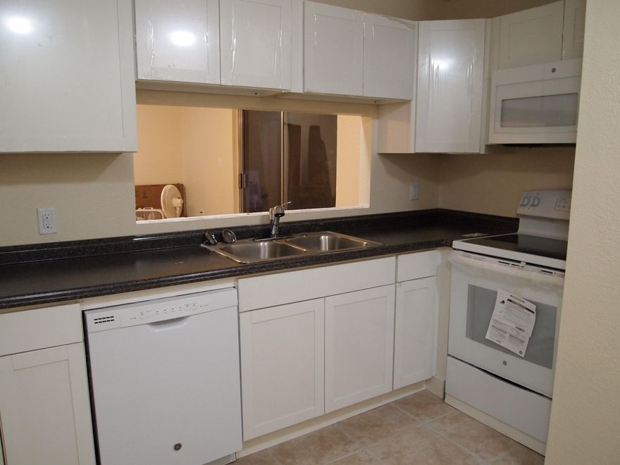 Everything is NEW in this ground floor CONDO! Perfect for a bachelor, roommates, empty nesters, investors.. This home features over $20,000 in renovations. NEW tile, new paint, new ceiling fans, new smooth top stove, new dishwasher, new built in microwave, new stainless steel kitchen sink, new beveled countertops and private laundry room. The bathroom sinks, faucets, vanities, mirrors, and light fixtures are all new. A new digital thermostat was installed & the kitchen was expanded. A matching custom bartop has arrived for the pass-thru. The owner renovated everything and hasn't even enjoyed it herself.You will be the first one in this Brand New Unit.The woodwork is all newly painted fresh, neutral colors. There is a list of all the upgrades under documents because there are too many to li