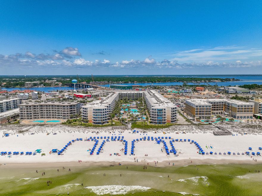 Top floor, Rental Machine at Waterscape Resort  with 2 bedrooms plus a bunk room and 2. 5 baths, fully furnished with WATERVIEWS of the Gulf, Bay, and Destin, FL! The condo has 1292 sq ft with a large private balcony. Both the bedrooms and living room have access to the balcony! The condo sleeps 8 and is a rental income machine ($84737, 2023) ! The kitchen has been remodeled with a level peninsula with quartz countertops. The peninsula seats 3-4 guests. The kitchen also has stainless and black appliances. The kitchen comes fully stocked for guests!