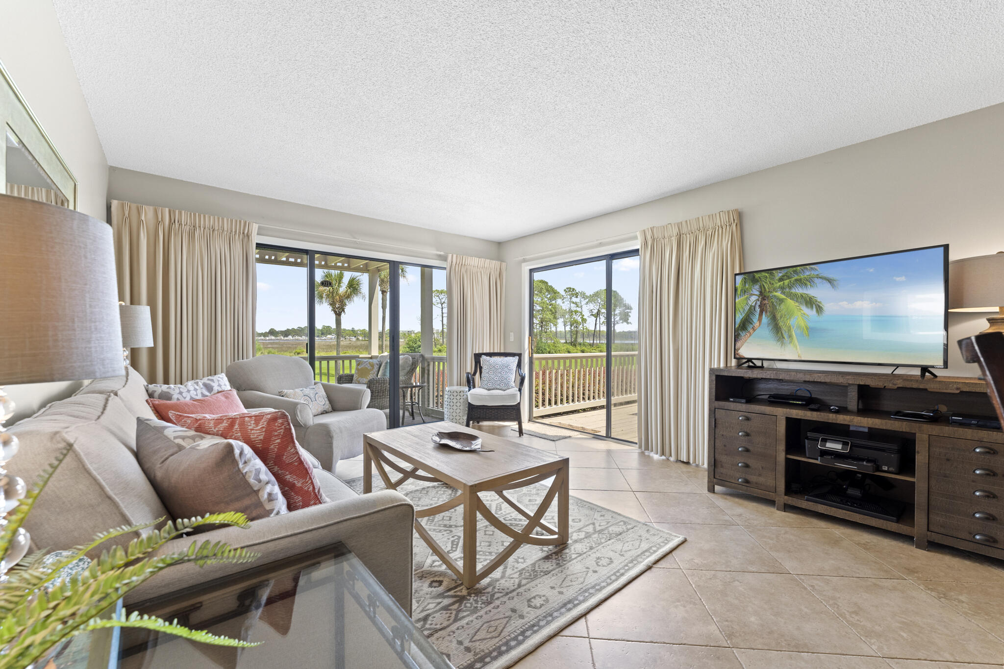 It's not very often that a condo with this location and view comes to the market after being in one family for nearly 30 years! Coveted LOWER level location with TWO decks and unparalleled views of the signature 14th hole of the Links Golf Course, Village of Baytowne, Marina, Bay and weekly fireworks display! Mostly used only as a 2nd home, lightly lived in and turnkey ready. Being sold completely furnished.