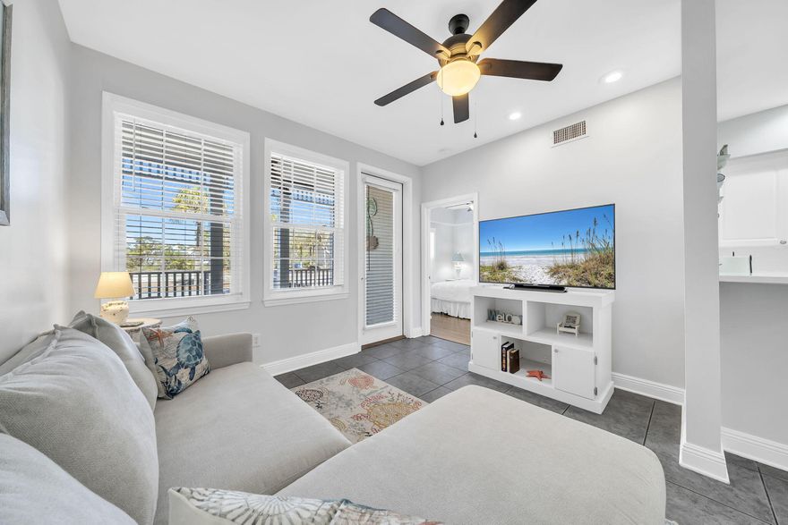 Welcome to The Village at Blue Mountain Beach a gated community located less than 1/2 mile from the sugar sand with lots of restaurants and shops only steps away. This ground floor end unit has lots of natural light with an open floor plan kitchen/living/dining. It also boasts three bedrooms with an ensuite primary bath and large closet on one side and the other two bedrooms and hall bath on the other. This unit is truly turnkey with fresh paint, brand new appliances and brand new furniture.  You'll find beautiful coastal decor throughout the unit making you feel relaxed and ready to enjoy 30A living. You'll also want to sit on the front porch and enjoy the quiet community or take advantage of the abundance of amenities. This beach retreat is perfect for a rental income property or a full time owner's enjoyment