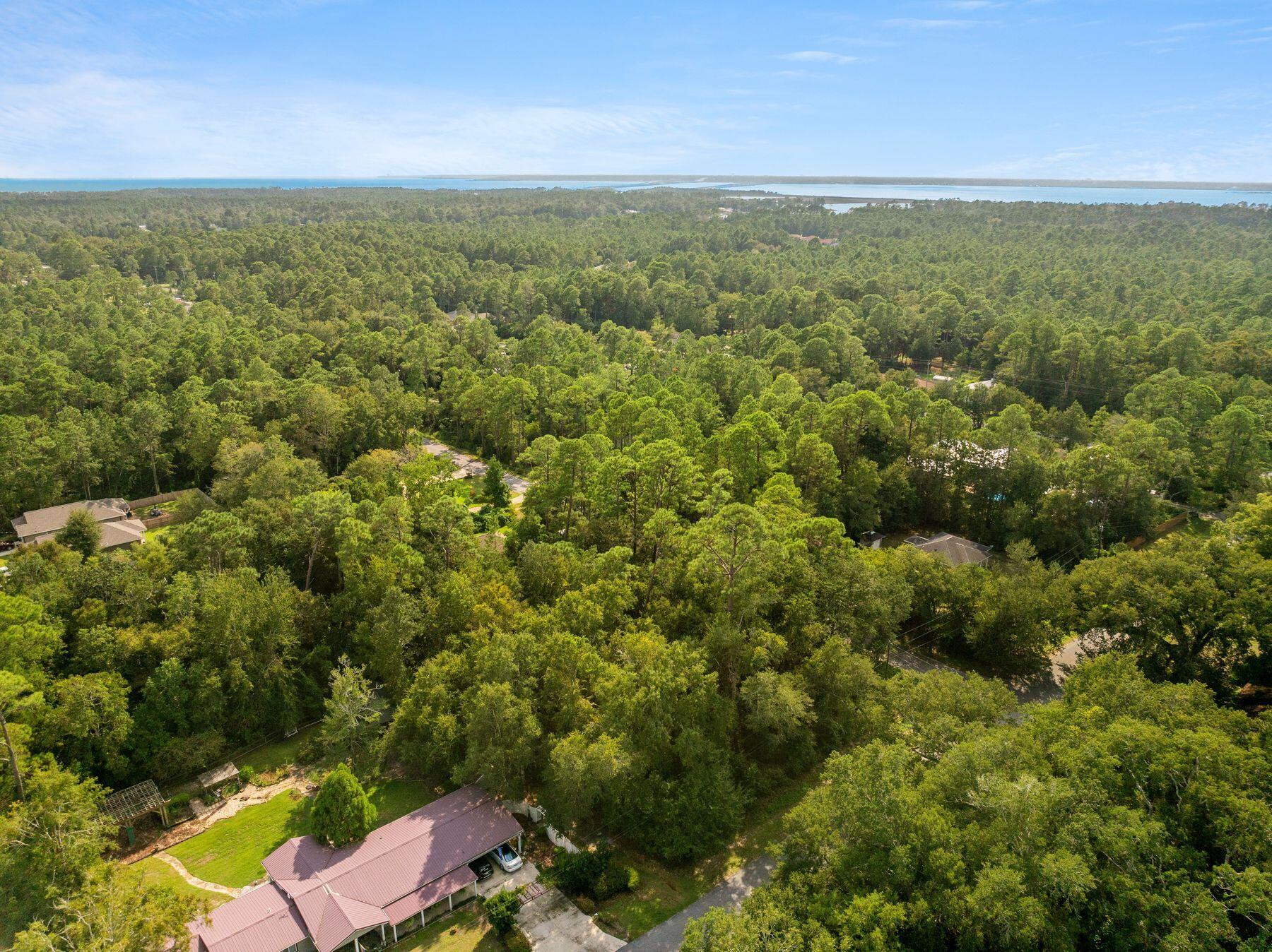 Discover the perfect canvas for your custom home in the serene community of Avalon Beach in Milton, Florida. These vacant lots offer a peaceful, natural setting just moments from the scenic Blackwater River, making them ideal for homeowners who value a tranquil lifestyle surrounded by nature. With ample space for building and a mix of wooded and cleared parcels, these lots provide endless possibilities for creating your dream home. Avalon Beach is an up-and-coming residential area offering privacy and growth potential. Many local builders specialize in crafting energy-efficient, coastal-inspired homes that blend modern amenities with the charm of the Gulf Coast. Whether looking for a primary residence, a second home or an investment opportunity, Avalon Beach offers an affordable option in