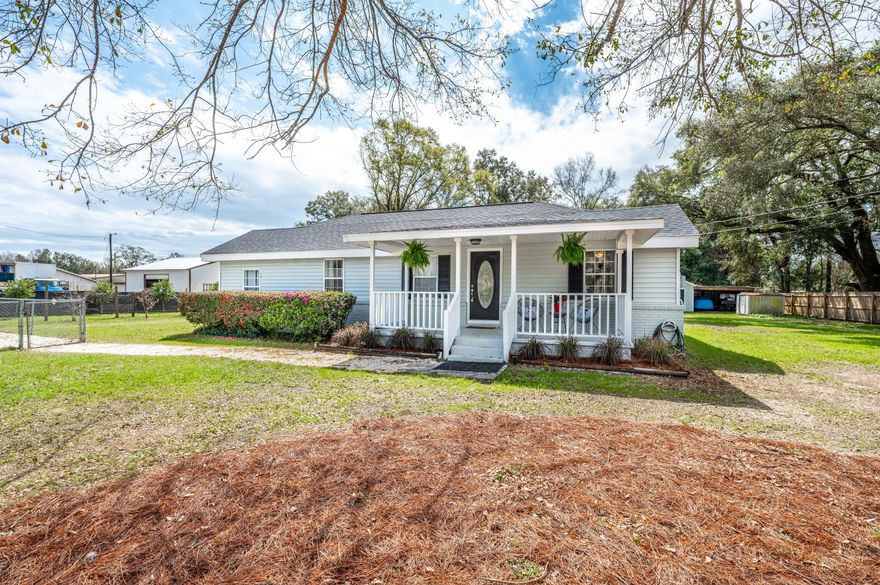 Conveniently located on a large lot (.63 acres), this renovated home offers a BRAND NEW ROOF, above ground swimming pool with a BRAND NEW LINER, an over-sized detached 2 car garage, carport and yard building. With no HOA you can park all your toys on property and utilize the 220 hook up perfect for an RV or camper. You'll enjoy the new luxury vinyl  wood-look flooring throughout, renovated kitchen and full master bathroom addition. The kitchen has new gorgeous granite countertops, stainless steel appliance with a new stove, built-in microwave, fridge with ice & water dispenser and a pantry. The spacious primary suite offers a walk-in closet and the NEW bathroom has a custom tile walk-in shower, double Quartz vanity and a water closet. The bonus room makes for a perfect office space and wou