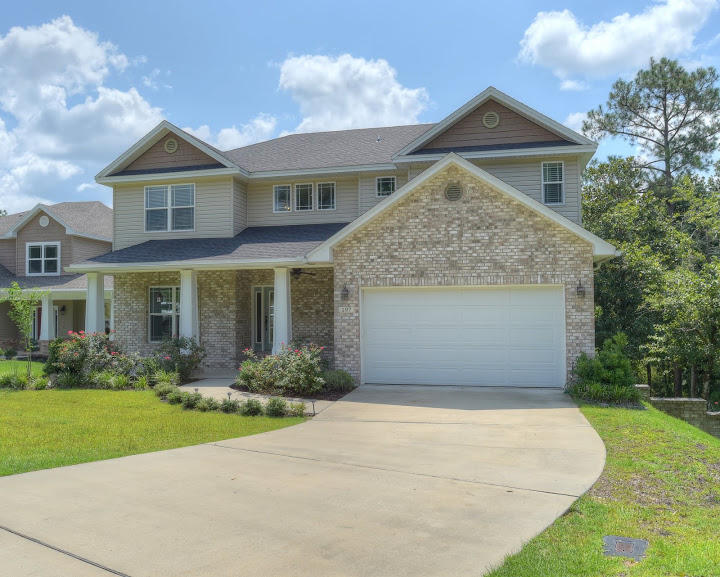 A perfect home for a larger, active family or for someone who could use two separate living spaces. This home comes with a finished 1300 sq/ft basement complete with a full kitchen and a large bedroom/office. It also boasts a full rec room area- including a home theater with 125 inch HD projection system and theater surround sound as well as dart board, air hockey, foosball and a ping pong table which is *included* with the home. There is an additional 120 square feet of unfinished storage.The center island kitchen has energy saving appliances, gas cook top, double ovens with one being convection, granite counter tops. This home comes with ample energy saving features including insulated doors, vinyl-frame Low-E insulated windowns (impact rated), energy saving ceiling fans, and much more!!