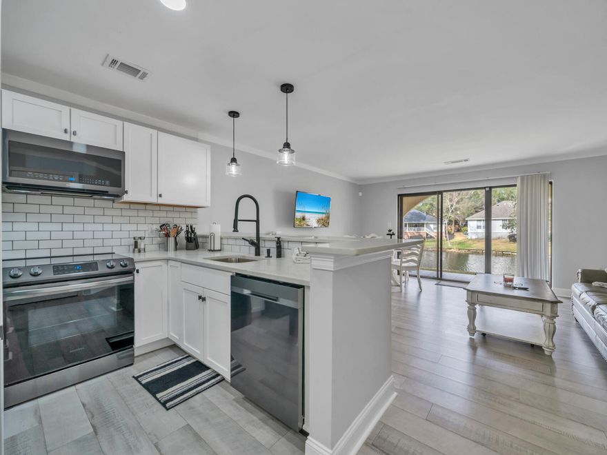 Experience lakeside living in this renovated 1 BD, 1 BA condo, a peaceful retreat in one of Bluewater Bay's most sought after community. The open-concept layout is bathed in natural light, creating an inviting space for relaxation & entertaining. Cook in the updated kitchen with a breakfast bar & unwind in the spacious living area that opens to a private, covered balcony--perfect for serene lake views. Recent updates include fresh paint & modern finishes, ensuring move-in readiness.Bluewater Bay offers resort-style amenities, including tennis & pickleball courts, golf, pools, walking trails & marina access. Just minutes from Destin's white sandy beaches, shopping & dining, this condo is ideal as a primary residence, vacation home, or investment property.