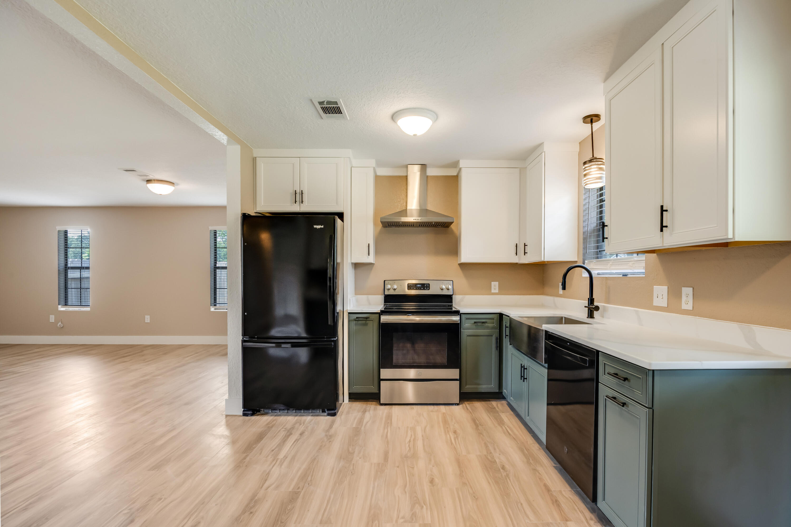 **Don't miss out on this remodeled half acre florida cottage style home!**This move-in ready home on almost half and acre, has everything you need. Includes NEW flooring, paint throughout, kitchen soft close cabinets, dishwasher, range hood, quartz countertops, kitchen sink, both bathroom vanities, ceiling fans, base boards, doors, new electrical, tankless water heater, hvac, and fenced yard. All the hard work is done; you just have to move in and add your personal touch.