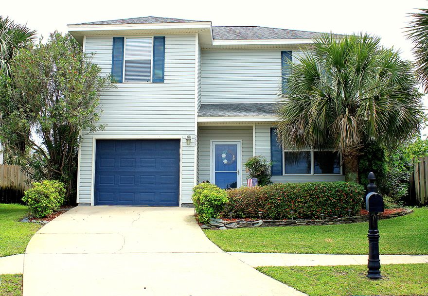Welcome home to 208 Wildcat Court- a meticulously kept home on a cul de sac with one of the biggest backyards in the subdivision located right smack in the heart of Destin. As you enter the home, 9 foot ceilings, crown molding, and 16'' tile invite you inside. Windows galore and a custom beveled glass, leaded back door brighten up the living space. The pantry/laundry room is right next to the kitchen and boast custom wood shelving. For added convenience, there is a half bath downstairs for guests. Upstairs are three bedrooms and two baths. The master suite has a spacious master bathroom and nice walk-in closet. The full bath between the two guest bedrooms has two door for entry from the hallway and one of the guest rooms. The fenced backyard is great for entertaining with the large custom