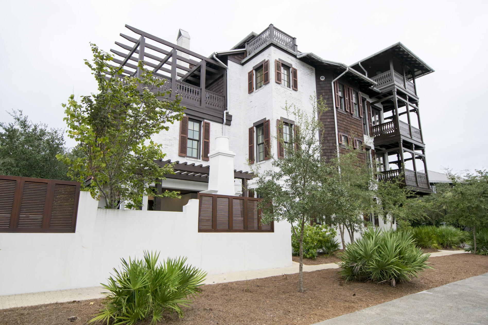 Entering through the front door into the foyer has ebony hardwoods meeting crisp white walls and a hand-forged wrought iron staircase. This is 25 Johnstown Lane  a 4 bedroom, 5.5 bath main house and 1 bedroom, 1 bath carriage house complete with two car garage. The property's antique white painted brick exteriors stand out as the end cap to Rosemary Beach's five townhouse properties. Located on the quiet northern end of the Rosemary Beach community, a short stroll to the new Owners Club and Pool at the St. Augustine Green there's no better place to call home.The first level guest room and en suite bath set the tone of a residence with exquisite furnishings. Custom finishes abound in all areas of the property with unparalleled attention to detail and design. its a must see property