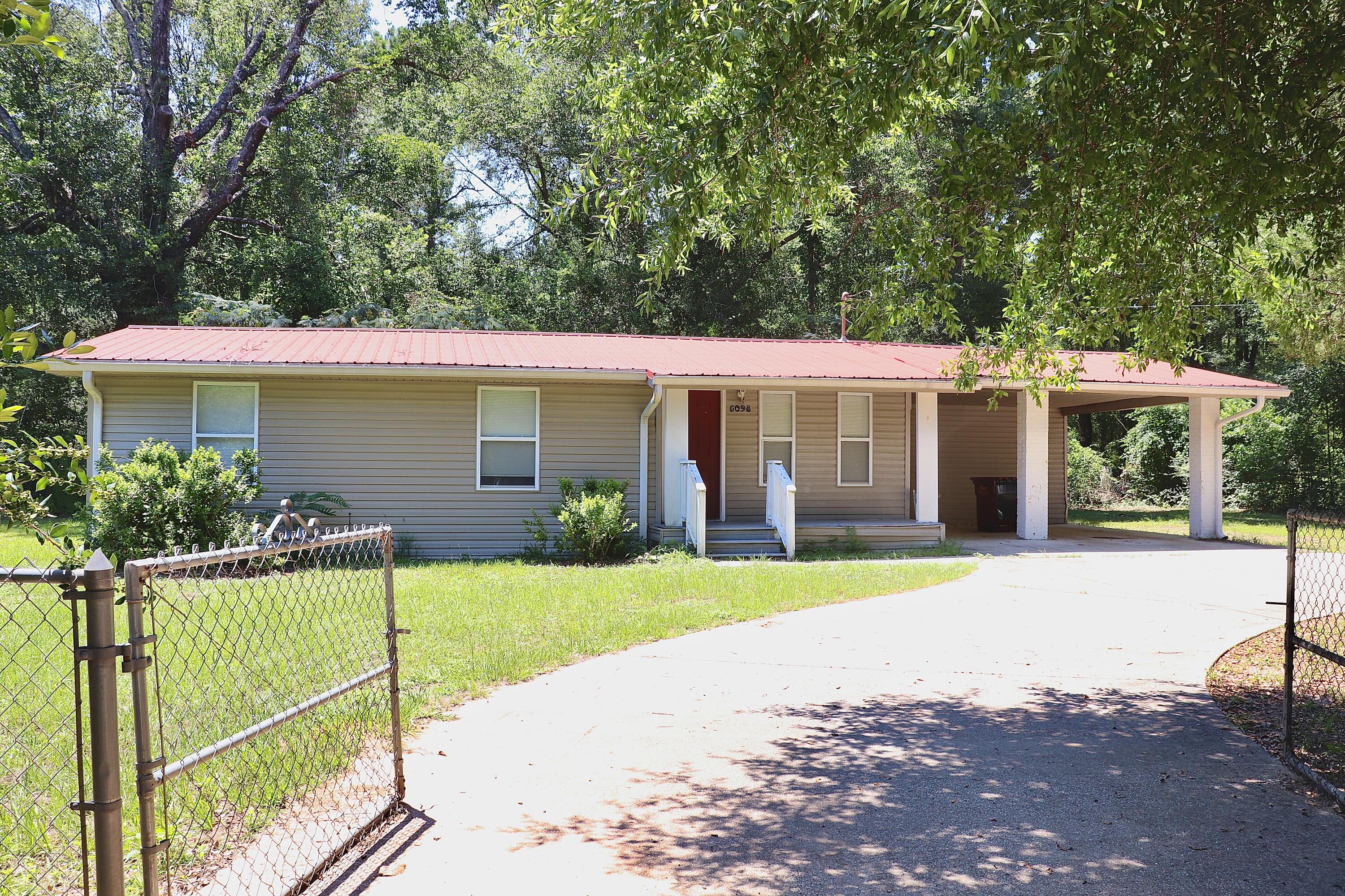 This cozy 3-bedroom, 1-bathroom home sits on a spacious and fully fenced 0.62-acre lot. Enjoy the peace and privacy this property offers, with plenty of room for outdoor activities. Included on the property is a well maintained 2-bedroom, 2-bathroom mobile home, perfect for generating rental income or accommodating extended family. This unit is newly vacant providing immediate income potential. Property Highlights:Survey is complete: The lot cannot be divided; however, it offers additional investment opportunities. Location: Conveniently located in Baker, FL, providing a balance of rural tranquility and accessibility to nearby amenities. Don't miss this unique opportunity to own a versatile property with immediate income and future development potential!