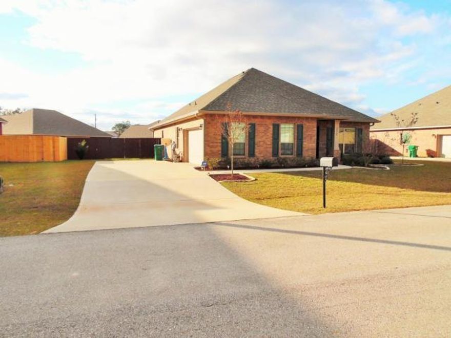 Gorgeously well-kept, newer construction brick home in North Crestview's Autumn Woods subdivision. Spacious, nearly 2000sq ft ''Bailey'' floor plan boasts large room sizes & a bonus office/formal dining with glass inlet french doors. Upon entry the 9'' ceilinings and tile floors lead you into the stunning, granite topped kitchen with matching stainless appliance package to convey. Oversized living room overlooks the screened in patio for more functional entertaining space. Master bedroom boasts tile floors, granite topped his/her sinks, separate shower and soaking tub. Outside, the back yard is fully fenced & the landscaping has been freshly updated. Side entry garage has pull down stairs with ample attic storage shelves in place and window shields for storms, for added peace of mind.