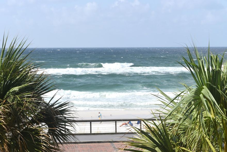 PARKING PLACE #B6 - ONE OF A FEW UNITS THAT HAS A DESIGNATED GARAGE PARKING SPACE! This is the sought after diamond floor plan with gulf view & balcony access from the master bedroom as well as from the living area. The great thing about this two bedroom, two bath condo is that you can sit on the balcony & feel like you are right on the beach. The palm trees hide the street! The kitchen has been updated with pretty granite & stainless steel appliances & the hot water heater is brand new! This condo can sleep 8 comfortably with the sleeper sofa & sleeper loveseat. The floors are tile throughout the entire condo  not just the living area. No need to fight the elevator crowdsjust walk down one floor & you are on the beach. Conveniently located in one of the most central locations