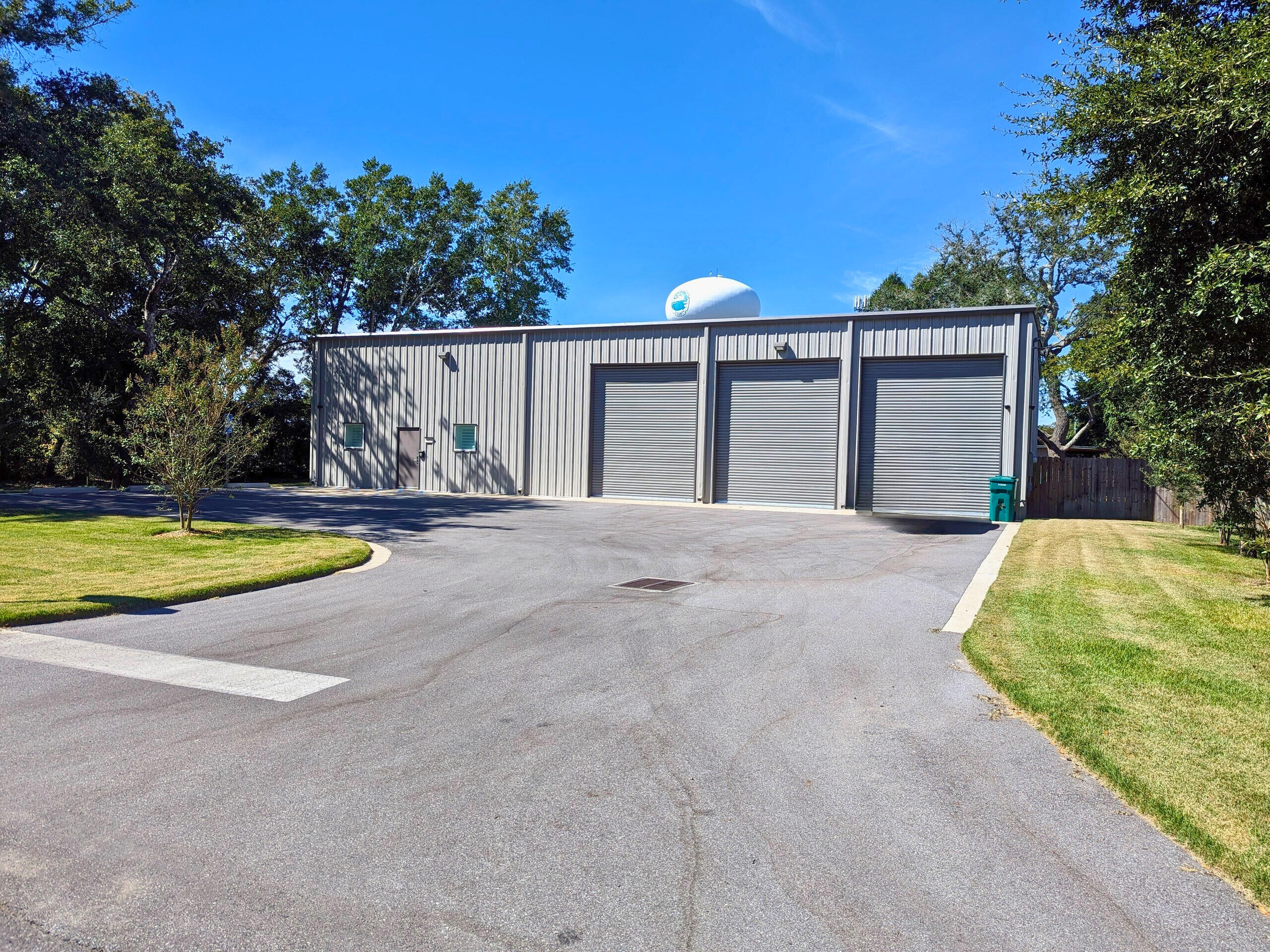 Industrial Warehouse plus office space. Warehouse has 4016 sq ft on the first floor plus 784 sq ft of office space and 784 sq ft of storage above the office space. Entire building is air conditioned. Paved parking in front of the building. 3 14ft rollup doors on the front and 1 14ft rollup door on the back. Back is completely fenced in. 1/2 acre lot leaves lot of room in the back for equipment or trailers. Built in 2021. Epoxy floors in the warehouse. 220 v, 30-amp and 50-amp power available. Security cameras inside and outside. A 40 x 8 storage container with electric is in the back and conveys. Office space consists of 3 offices, a break area and a restroom.