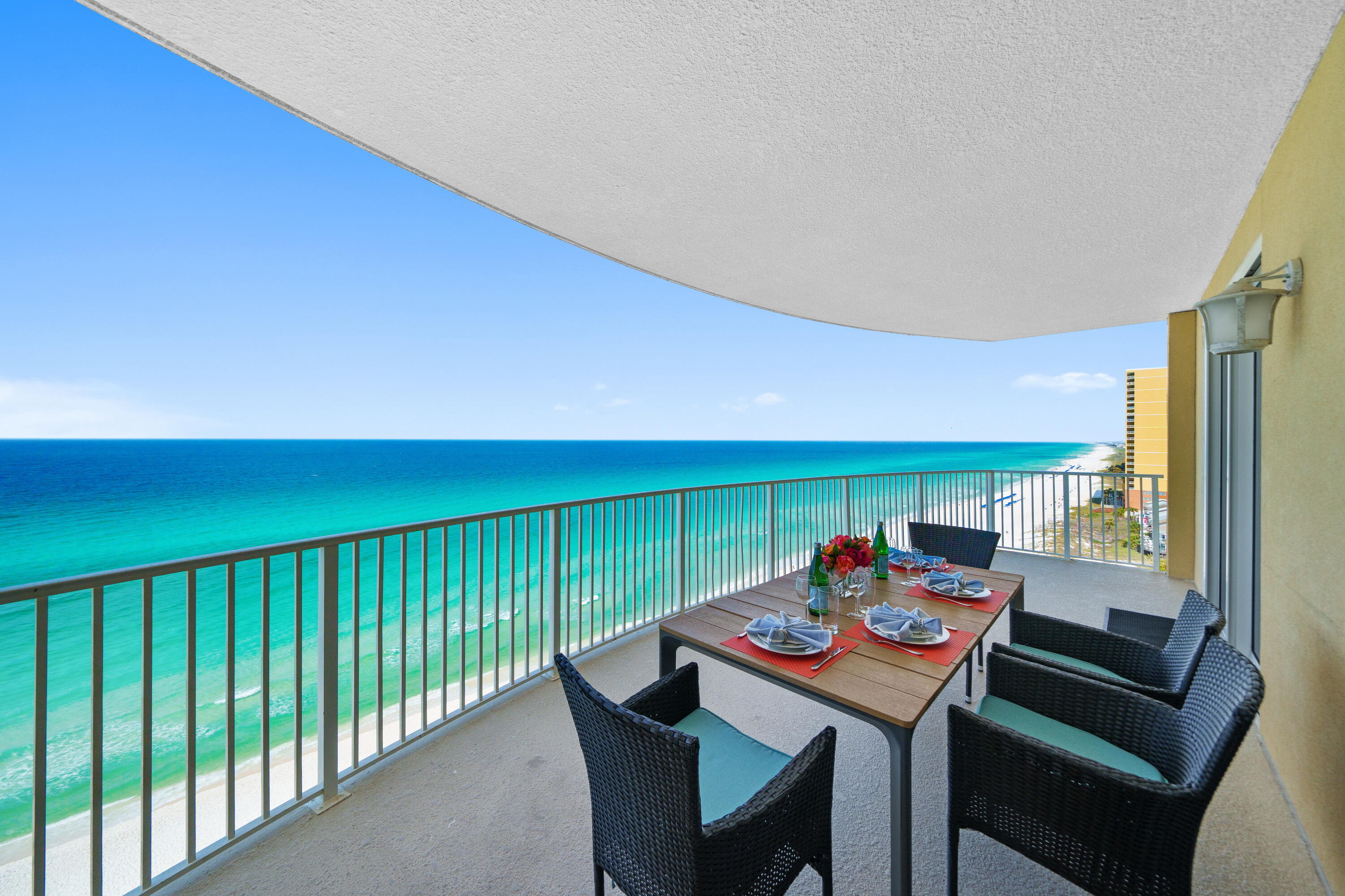 Step into your 13th-floor coastal haven above Panama City Beach's sugar-white sands. This isn't just a condo--it's a front-row seat to paradise with sweeping Gulf views and refined coastal luxury. Floor-to-ceiling glass reveals 180-degree emerald sea vistas, while a massive, curved balcony connects the living room and primary suite to the sky and surf. Inside, enjoy quartz counters, spa-style showers, and new stainless appliances. With updated HVAC (2020), washer, dryer, and turnkey furnishings, it's ready for living or rental. Emerald Isle offers pools, hot tub, sauna, gym, beach service, and is pet-friendly. Claim your slice of paradise today.