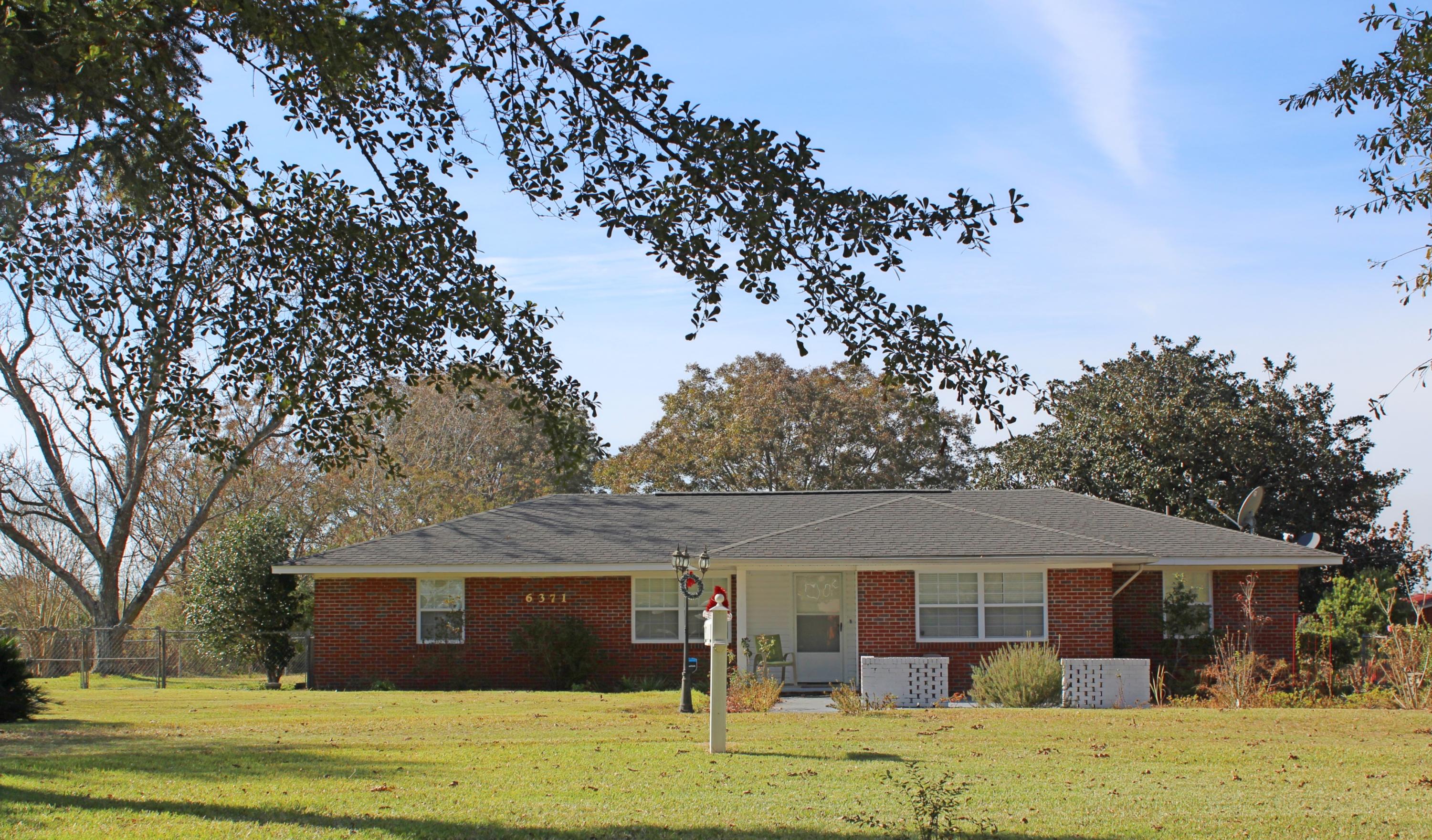 This is a house that you make your forever home. One owner has owned it and kept it well maintained for the last 30 years. Three bedroom, two bathroom, one story brick home on two acres set out in the country but only a short drive to town. Home comes with all of the furnishings and is ready for you to move right in! There has been several updates through the years. Electrical upgrades include the home being completely rewired. Plumbing upgrades include all pvc plumbing. Attic has had blow in insulation added to keep utility bills low. This home has so much storage space. Outside there are so many features which include a 19 x 11'6'' screened in porch, storage buildings, circular driveway, two carports and pecan trees! Make your appointment to see this home today!