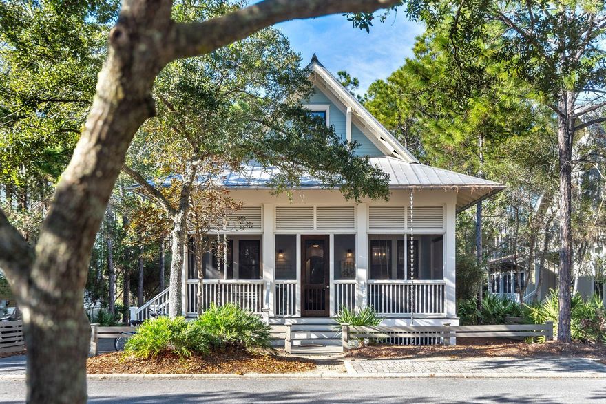 Nestled within the prestigious confines of WaterColor's serene community and set on a tranquil street near Camp WaterColor, this inviting beach house embodies the essence of family-friendly living with its charming blend of hardwood floors, shiplap walls, and expansive 700 square feet of breezy porches that seamlessly integrate with the surrounding natural beauty.This home backs against a lush nature preserve offering a canvas of possibilities, including the option to add a private pool. Renovated in 2020, the home now boasts a spacious laundry/mud room, a stylish half bathroom with a sliding barn door, and expanded outdoor living areas.