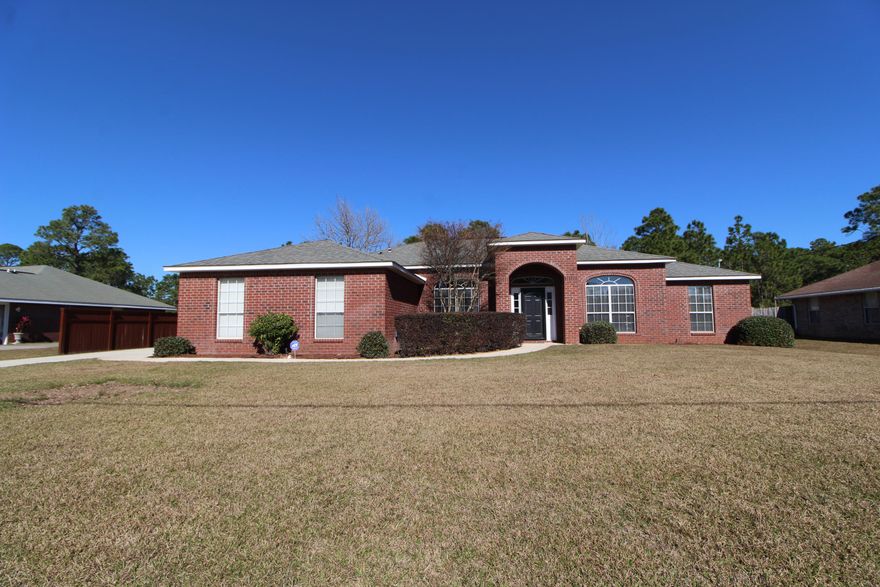 Wonderful all brick home situated on almost 3/4 acre lot on a quiet street in the desirable Holley by the Sea Community! Spacious living room with vaulted ceiling, corner fireplace with tiled front and mantle and sliding glass door that leads out to the patio and private backyard. Formal dining room with raised ceiling and a arched accent window. Light and bright kitchen with lots of counter space, plenty of cabinets, center island and large pantry. Breakfast area is placed in a wide bay window that overlooks the backyard. Master bedroom has trey ceiling with a remote control designer ceiling fan. Master bath with large walk-in closet, double vanities, whirlpool tub and separate shower. Split bedroom floor plan allows you additional privacy from guests or kids. Front bedroom would