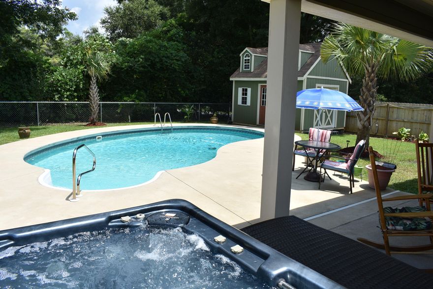 YOUR OWN PRIVATE RETREAT THAT IS TURN KEY READY FOR YOUR ENJOYMENT!! : Well designed floor plan that is perfect for family and entertaining. This Craftsman style home offers a FLEX 5 bedroom floor plan, open living spaces and a custom color palette. This well maintained, home was built in 2015 and is better than new. It has 4-5 bedrooms, 2.5 baths and is situated on a large corner lot. Well appointed throughout, this elegant home features trey ceilings and upgraded lighting and fans s well as ceramic wood-look tile throughout the entire home, there is NO CARPET. Upon entering, the living area opens to the kitchen and dining areas.The kitchen is a friendly zone of inviting and functional space, offering plenty of beautiful cabinets, granite counters, large island, stainless appliances