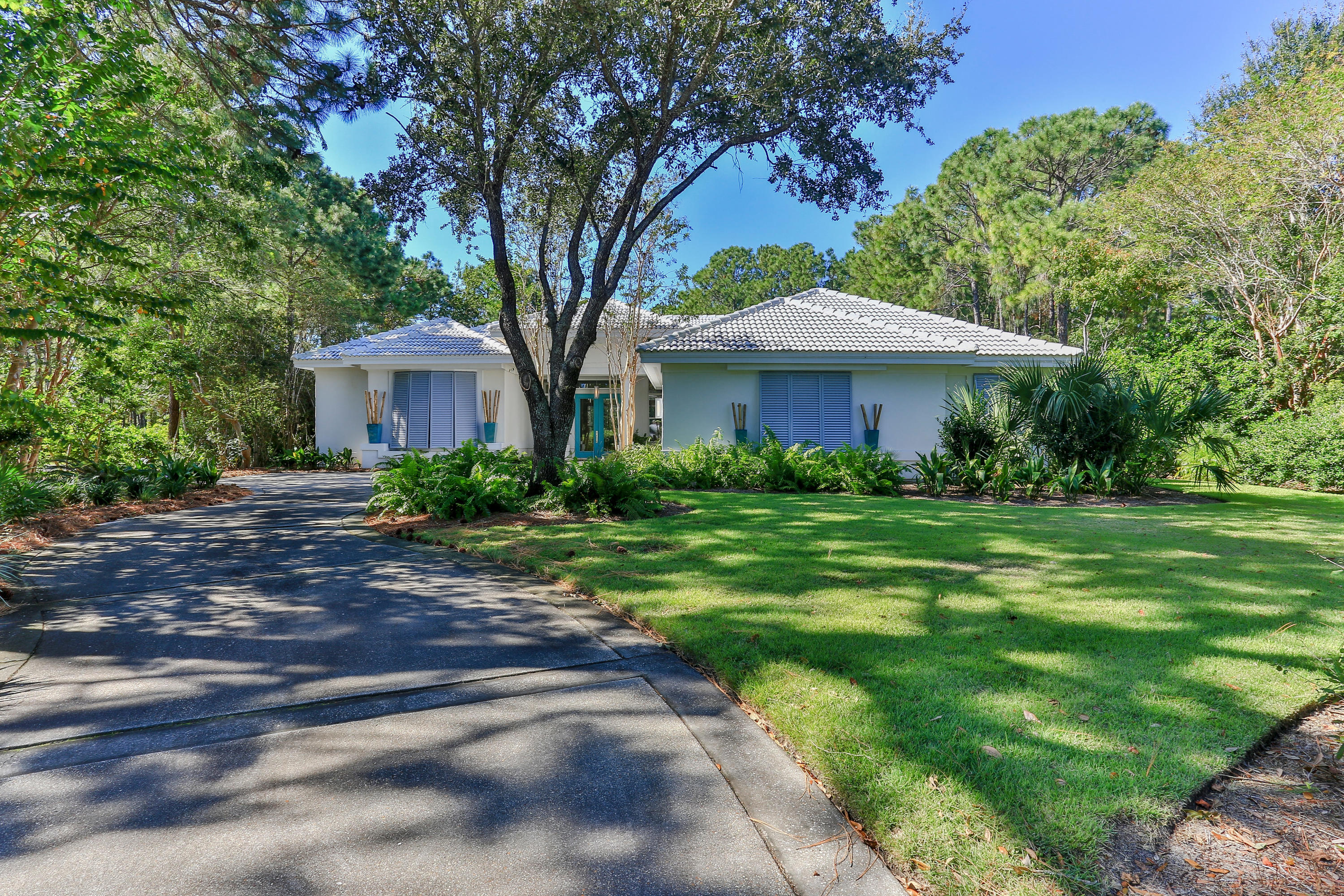 This stunning contemporary California-style home, by Award Winning Designer, lays in the heart of Destin's, Kelly PlantationWhere you will appreciate the security of one of the areas most beautiful and prestigious gated communities. A winding drive through meticulous landscapes to the quiet and seclusion of this rare and incredible home nestled on a private cul-de-sacenhances this truly one-of-a-kind property that has been recently rebuilt & like new throughout in the past two years. High ceilings, clean lines & sleek grey wood-looking tile floors help provide an open, clean feel. Glass walls with over a dozen stacked sliding doors on three sides brings the outdoor pool area, inside to the two large living rooms, a formal and a family dining room, which flow into the new chef's kitchen