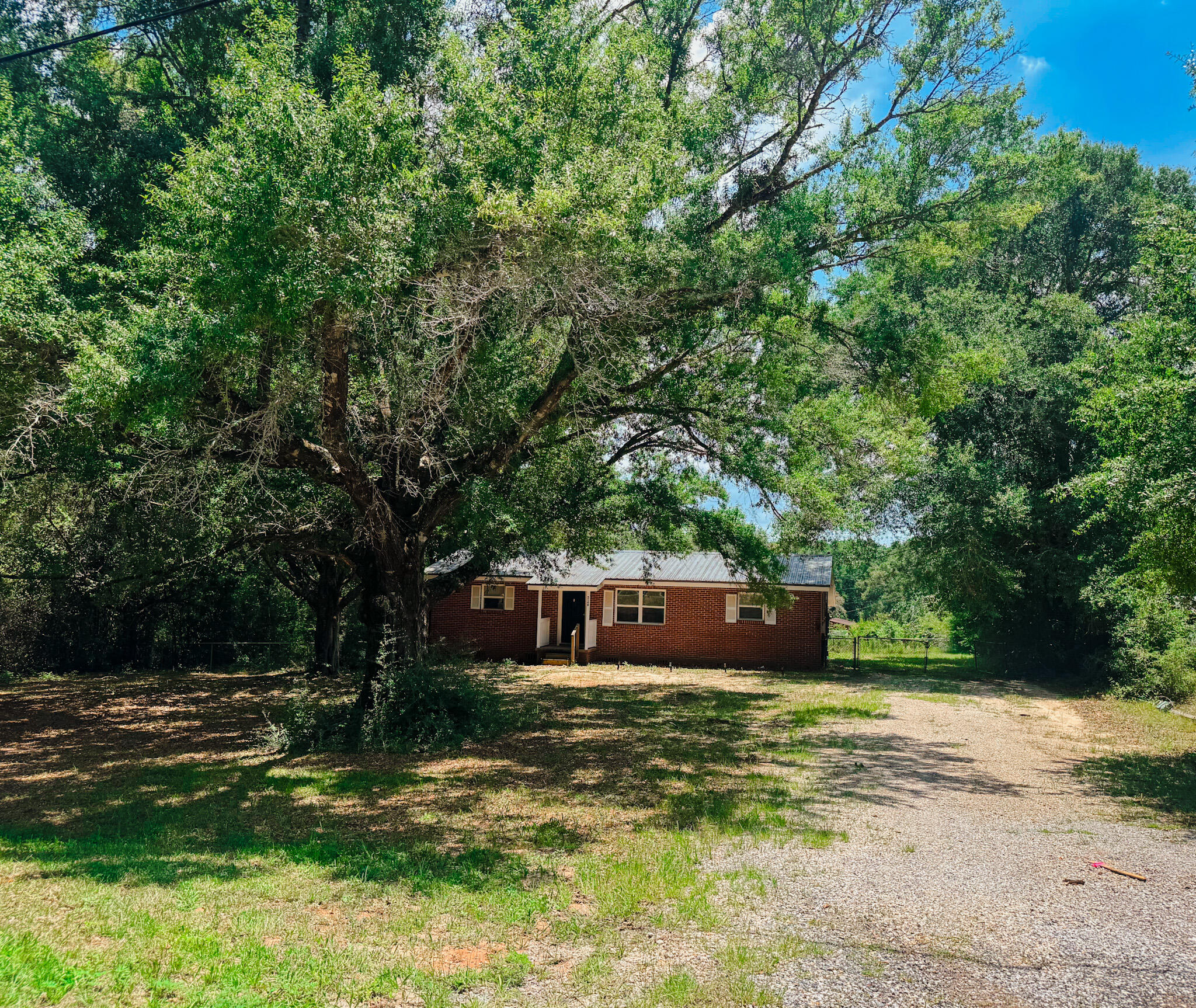A classic 1960s Traditional Brick Home located in a quiet, dead-end neighborhood in Crestview. This well-maintained home features solid hardwood floors, three bedrooms, and two full bathrooms. Enjoy outdoor living with a covered back porch--perfect for relaxing or entertaining. A great opportunity to own a classic home with timeless appeal and room to make it your own.