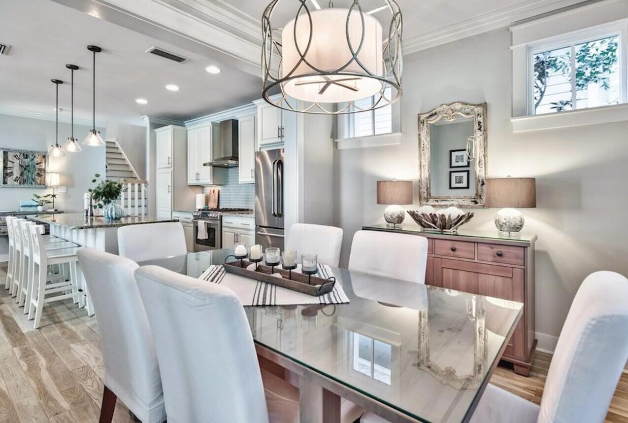 Tucked away behind the exclusive gates of prestigious Watersound West Beach, this captivating residence offers a serene escape to the beach. Located on a corner lot, adjacent to the walking trail with direct and private access through Deer Lake State Park; leading to one of the most untouched and beautiful beaches along the 30A corridor. This home is a testament to coastal luxury, with an open-concept design that beckons families and friends to come together and celebrate beachside living. It's an oasis where you can revel in the calm of park vistas from both screened and open porches, embodying the peace that only a beach haven can offer.