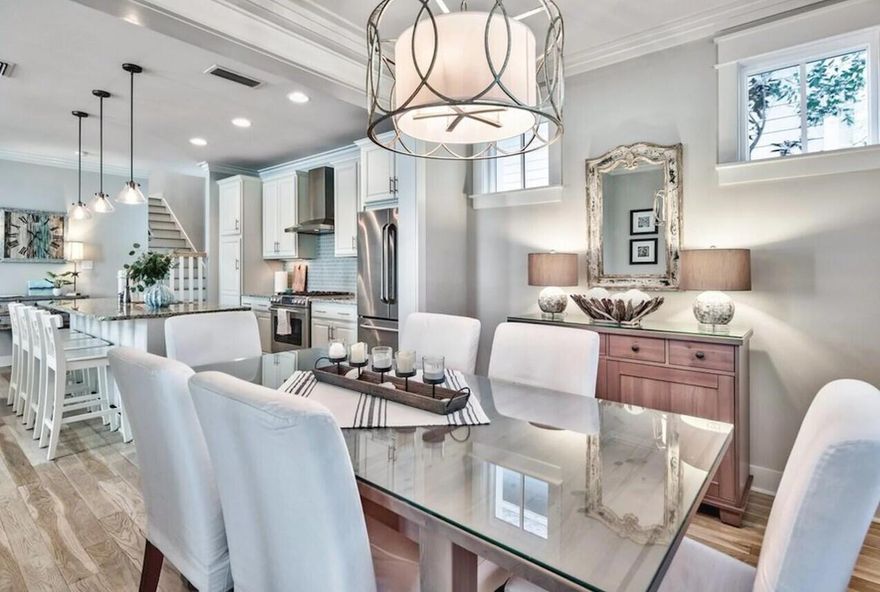 Tucked away behind the exclusive gates of prestigious Watersound West Beach, this captivating residence offers a serene escape to the beach. Located on a corner lot, adjacent to the walking trail with direct and private access through Deer Lake State Park; leading to one of the most untouched and beautiful beaches along the 30A corridor. This home is a testament to coastal luxury, with an open-concept design that beckons families and friends to come together and celebrate beachside living. It's an oasis where you can revel in the calm of park vistas from both screened and open porches, embodying the peace that only a beach haven can offer.