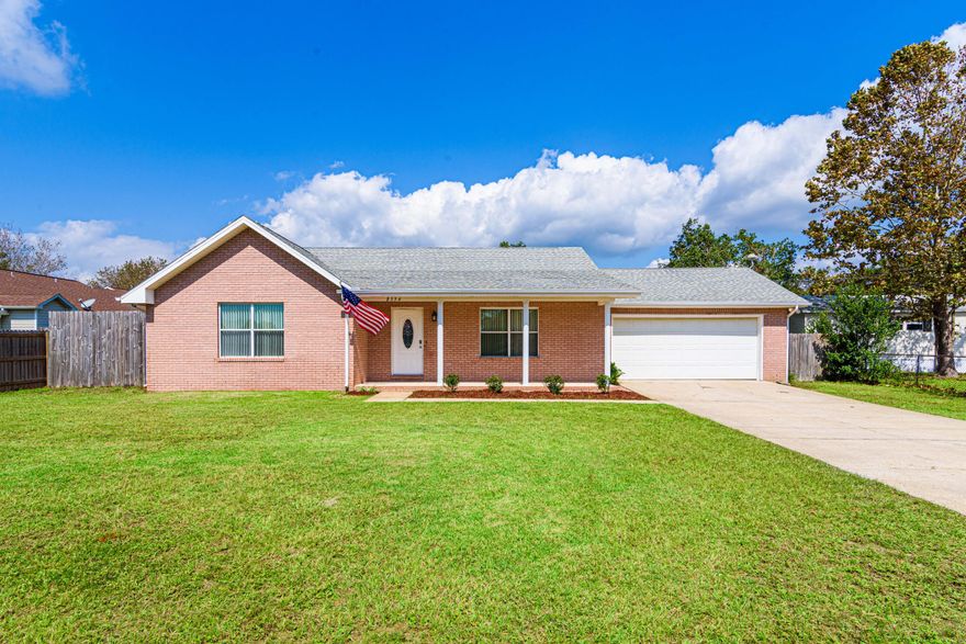 No HOA! Centrally located in Navarre, off of Hwy 87. Two car garage. Open floor plan with recess lighting in living room. Two large bedrooms with two full baths. Updated flooring with durable hand scraped vintage antique bamboo flooring throughout the home. Appliances in kitchen replaced in 2018.  Gas oven and range. AC and HVAC system replaced in 2016. Windows updated with doubled insulated windows in 2016. Storm shutters included.