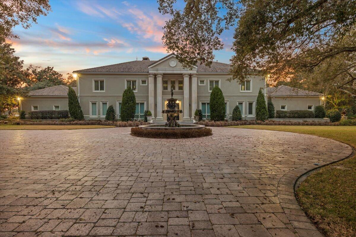 This exclusive Waterfront Estate is located on a private 4.5 acre lot, featuring lush landscaping and large oak trees with over 281 feet of deep water frontage on Joe's Bayou. Hidden in the heart of Destin. Features of the spacious 9188 sq. ft home includes, an elegant master suite wing with bedroom and large sitting area, fireplace, a large dressing closet room, exercise room with full length mirrors, an Italian marble tile master bath, a coffee bar area, and magnificent views of Joe's Bayou. The grand room has a soaring ceiling with stone floors and French doors that open to area with heated pool and spa that overlook the bayou. A gourmet kitchen includes a breakfast area, pantry, butlers pantry, top of the line appliances, cook-top island, double ovens with warming drawer, wine