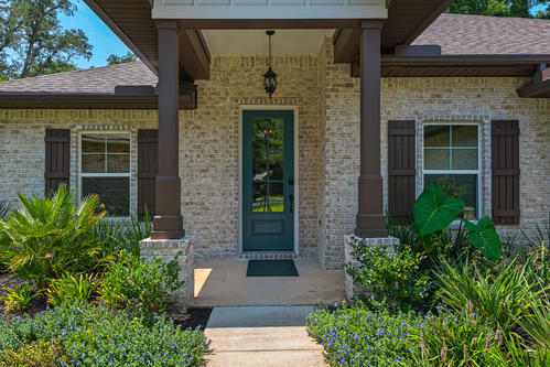 2019 Custom built home! Super close to shopping, downtown restaurants and 10 minutes to Destin. 4 bedroom/3 full bath, brick & concrete siding home sits on large lot with beautiful trees. Interior has 10 Ft. ceilings w/impressive crown molding, plank tile flooring throughout the main living area, master bedroom and wet areas. Also 5 1/4'' baseboard throughout. Open floor plan features gourmet kitchen, huge living area which boasts espresso colored cabinetry, granite counter-tops, counter level breakfast bar and stainless appliances (over-sized commercial grade frig./freezer and beverage cooler). All cabinetry features soft close glides and hinges. A walk-in pantry is located at the rear of the kitchen. Over $20,000 in upgrades, window tint, treatments, cabinetry systems, garage floors, etc